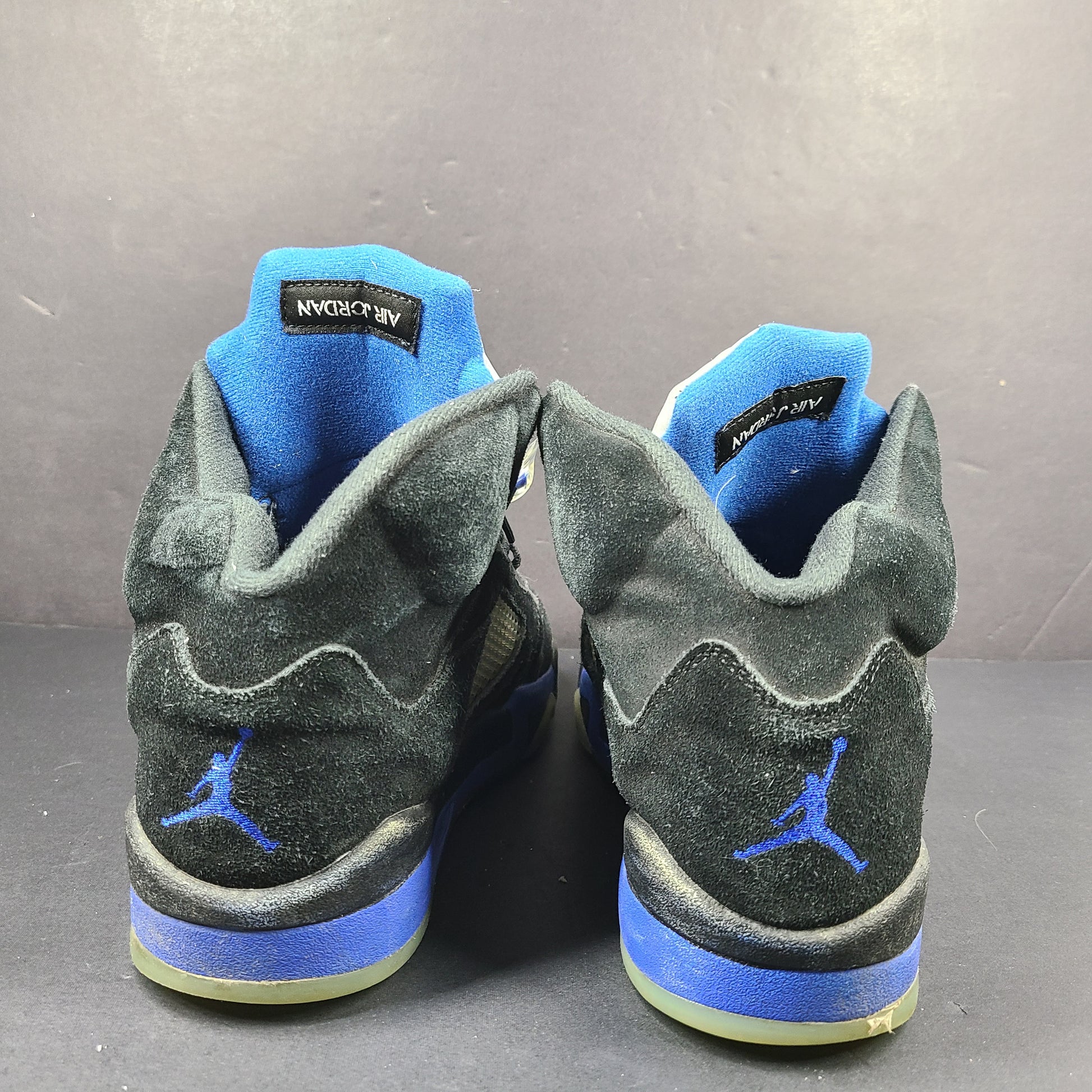 Nike Air Jordan 5 Retro Racer Blue sneakers in black and racer blue, UK 10 with Air Jordan branding on heel and tongue.