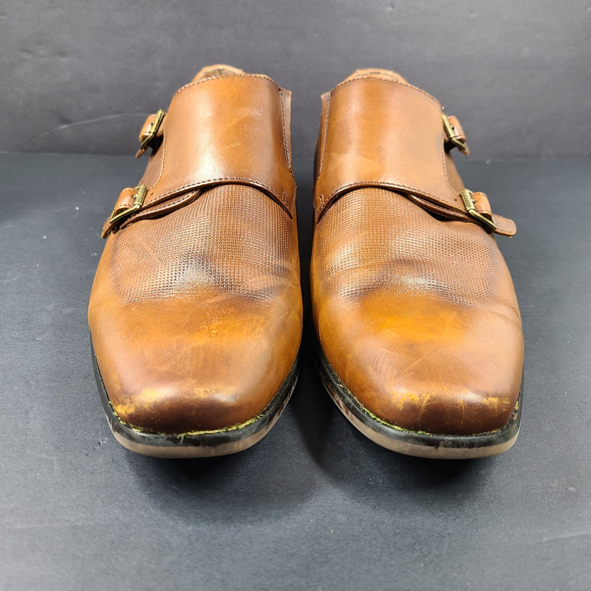 Brown Florsheim men's leather dress shoes size 9.5D with a leather upper and manmade balance materials.