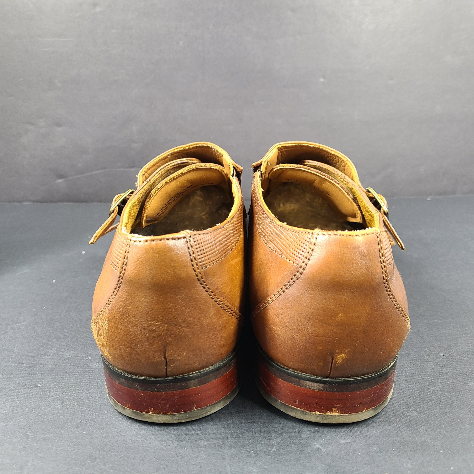 Brown Florsheim men's leather dress shoes size 9.5D with a leather upper and manmade balance materials.