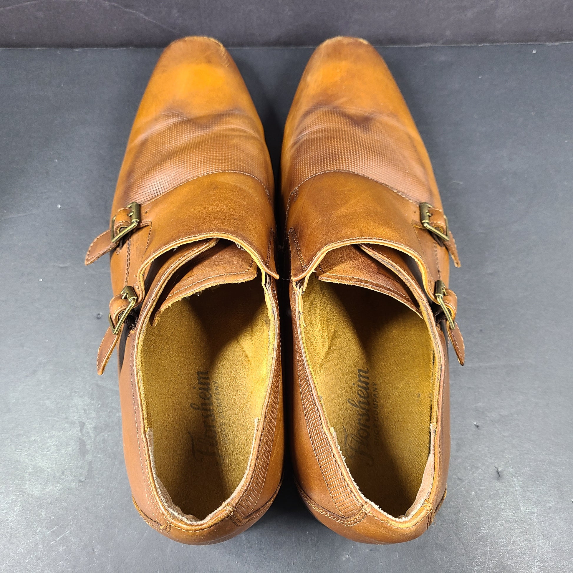 Brown Florsheim men's leather dress shoes size 9.5D with a leather upper and manmade balance materials.