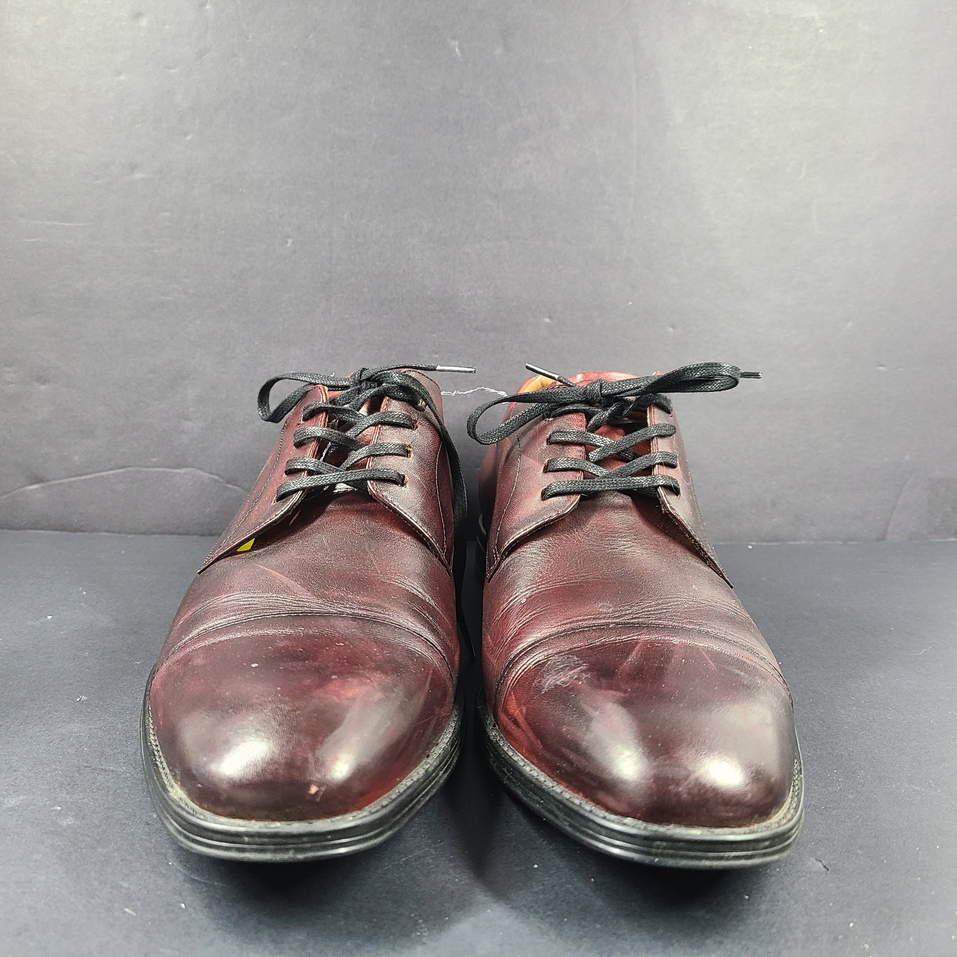Brown Florsheim men's leather dress shoe in U.S. size 10.5 M with manmade sole balance.