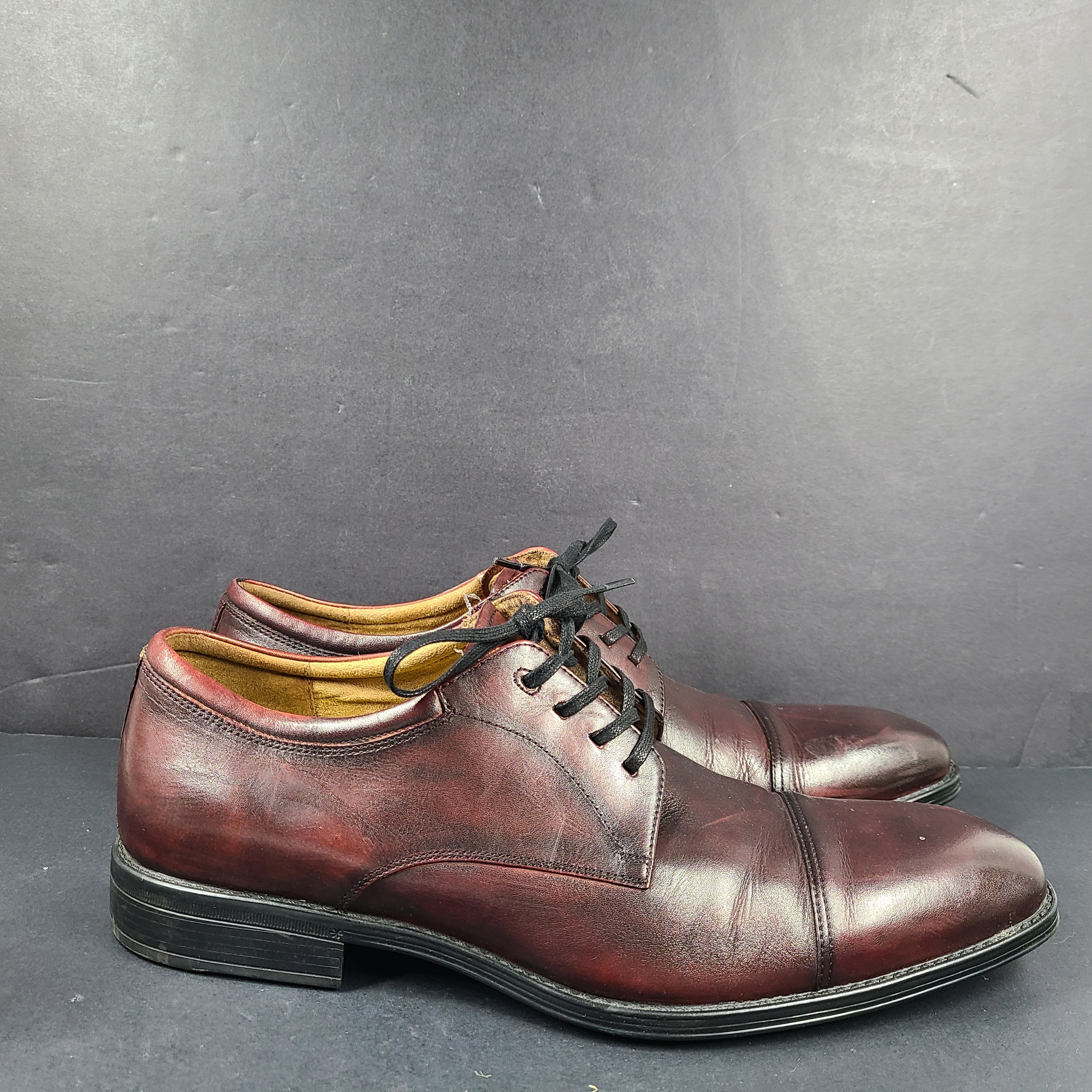 Brown Florsheim men's leather dress shoe in U.S. size 10.5 M with manmade sole balance.