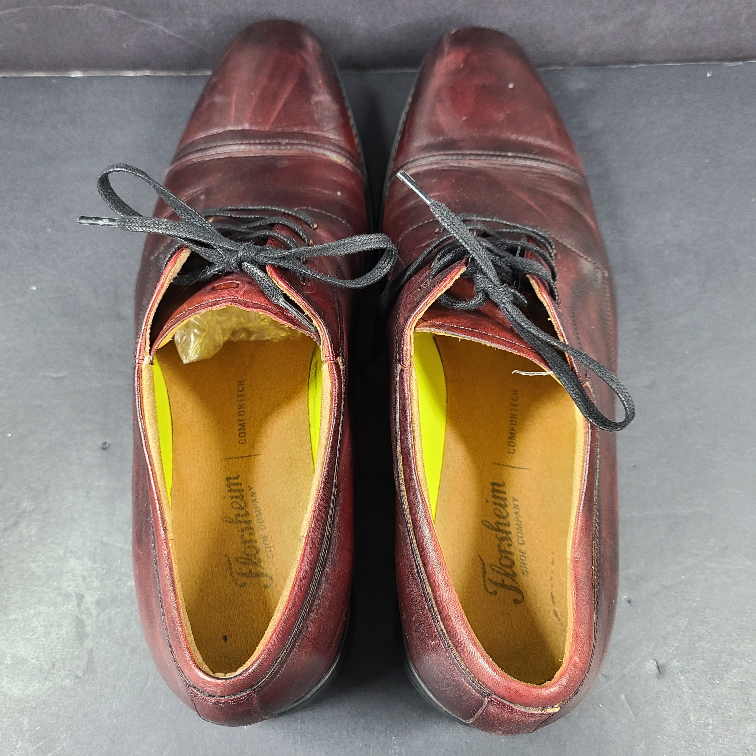 Brown Florsheim men's leather dress shoe in U.S. size 10.5 M with manmade sole balance.