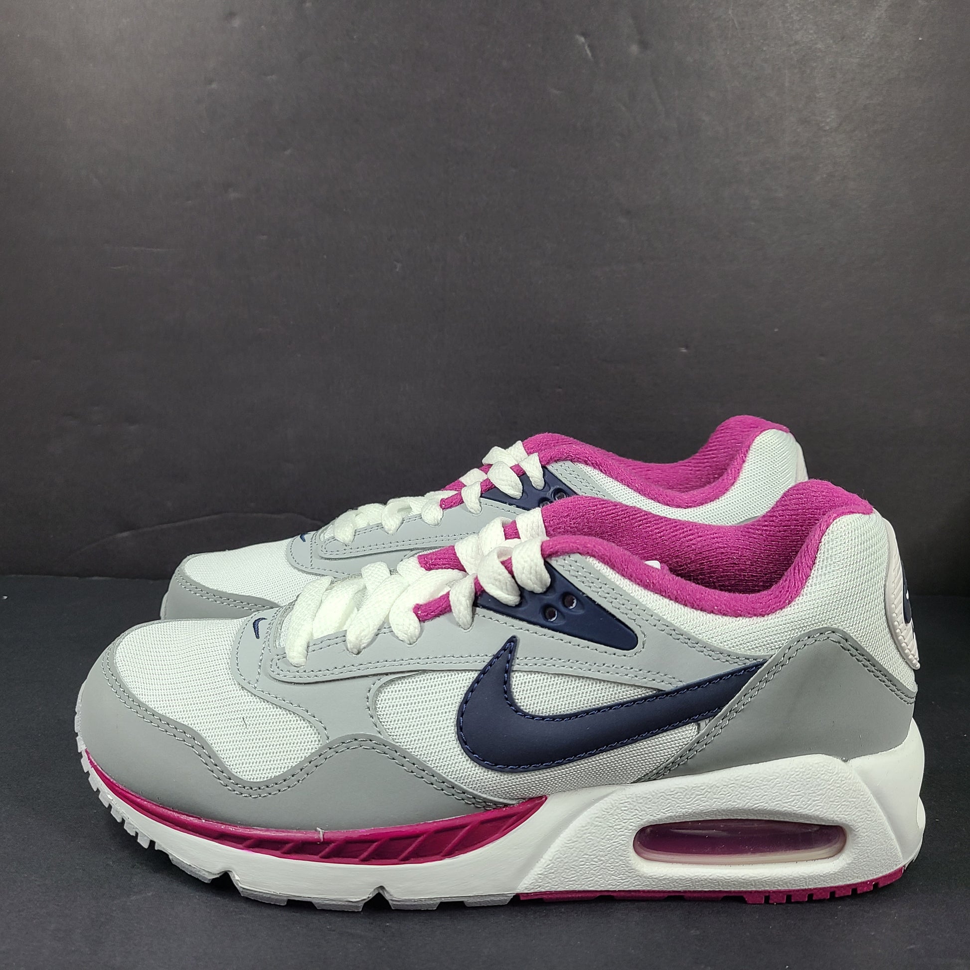 White, grey and pink Nike Air Max Correlate women's sneaker in US size 7.5 with Air Max cushioning.
