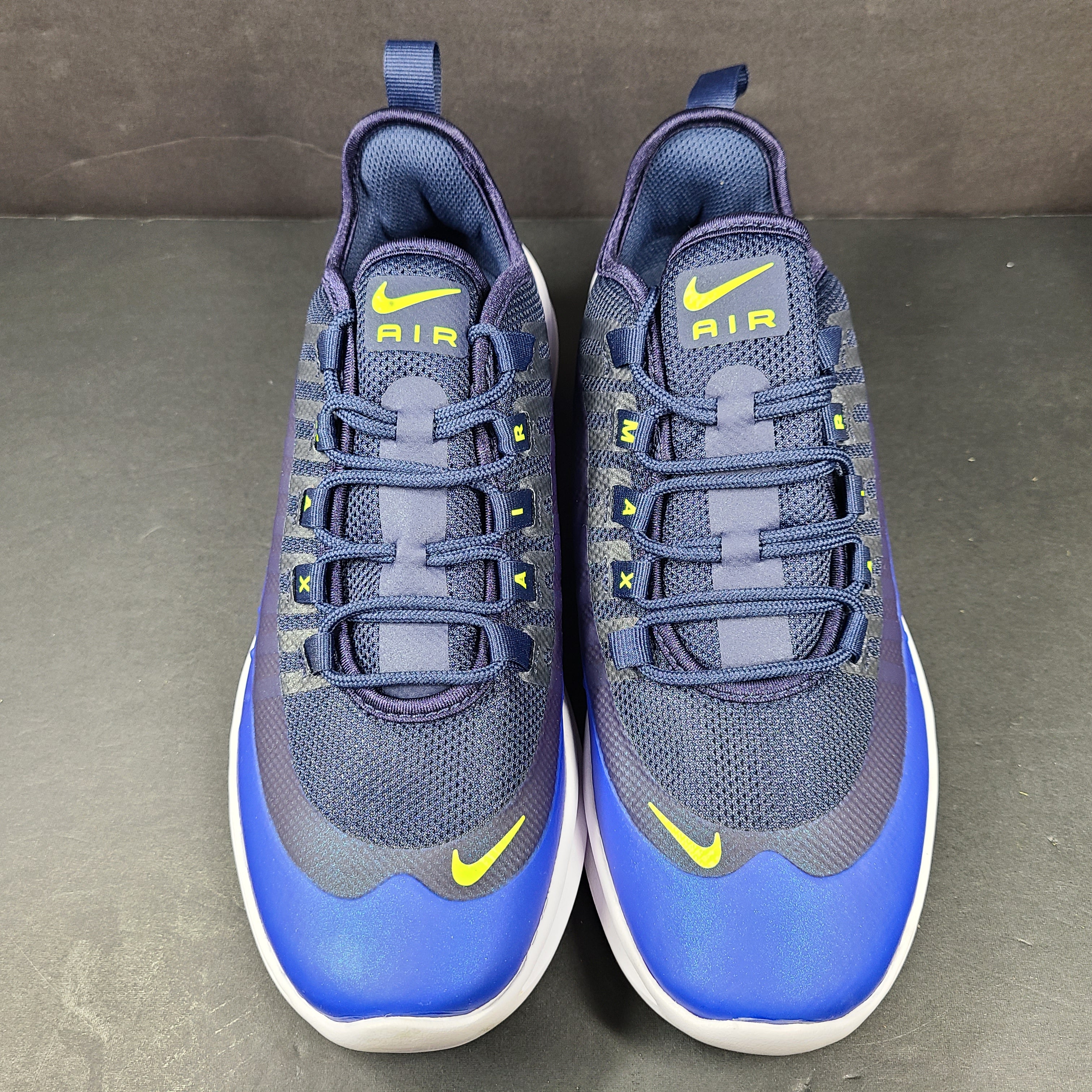Nike Air Max Axis youth running shoe in midnight navy blue with Air Max cushioning and breathable mesh upper.