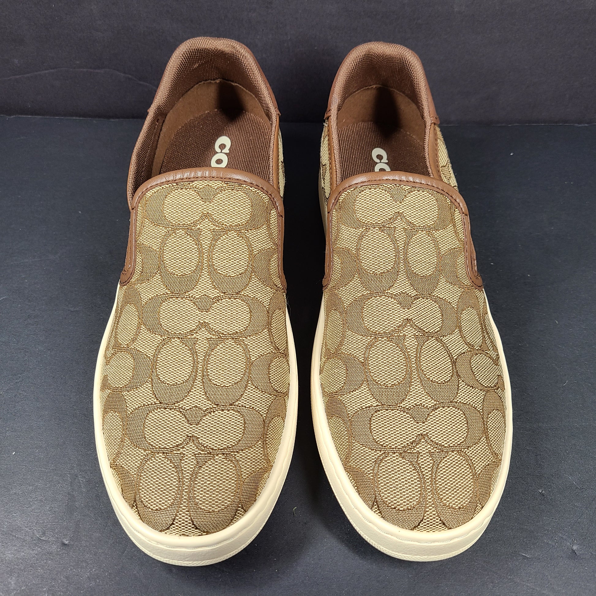 Coach slip-on sneakers model C4393 in brown, size 6.5B, designed for everyday wear.
