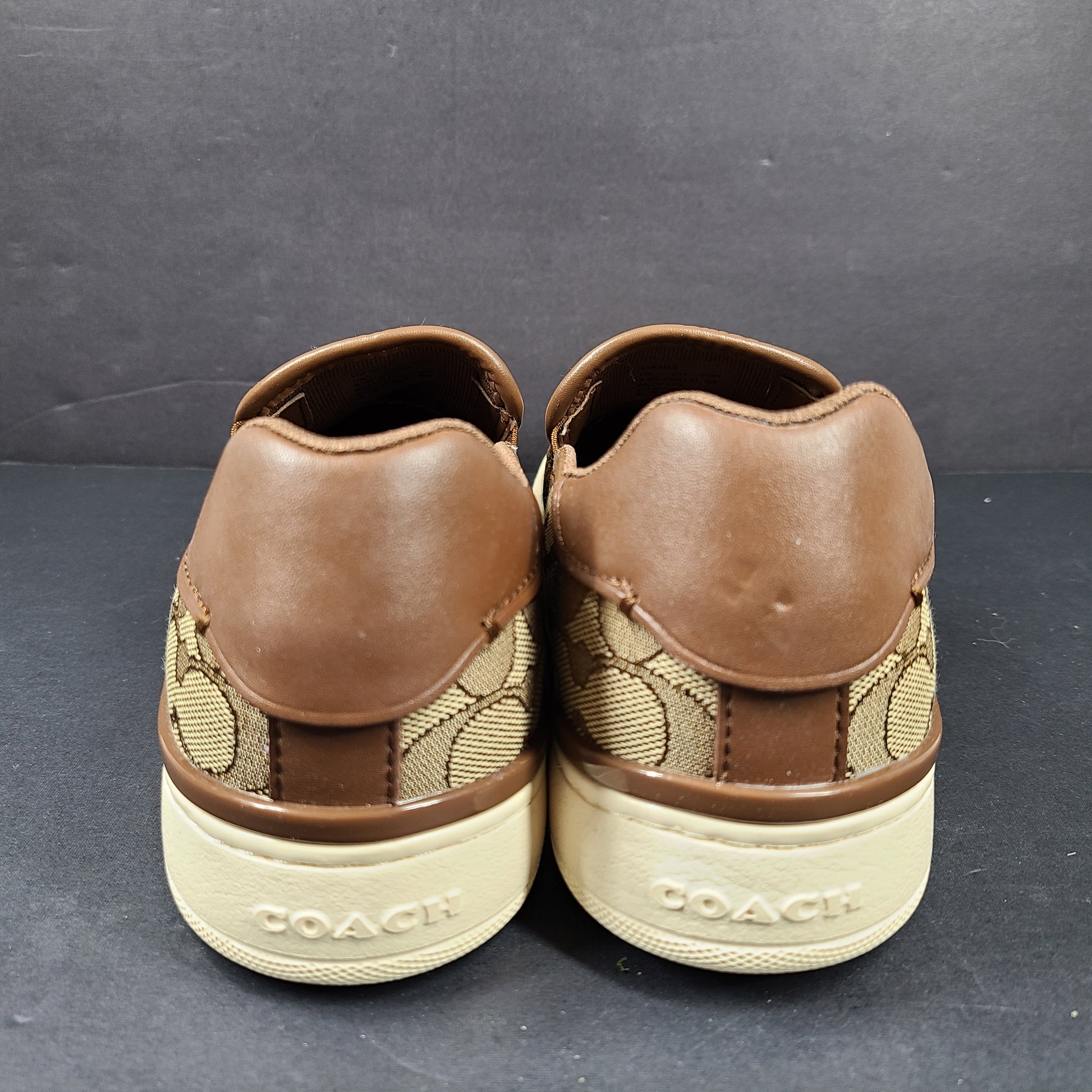 Coach slip-on sneakers model C4393 in brown, size 6.5B, designed for everyday wear.