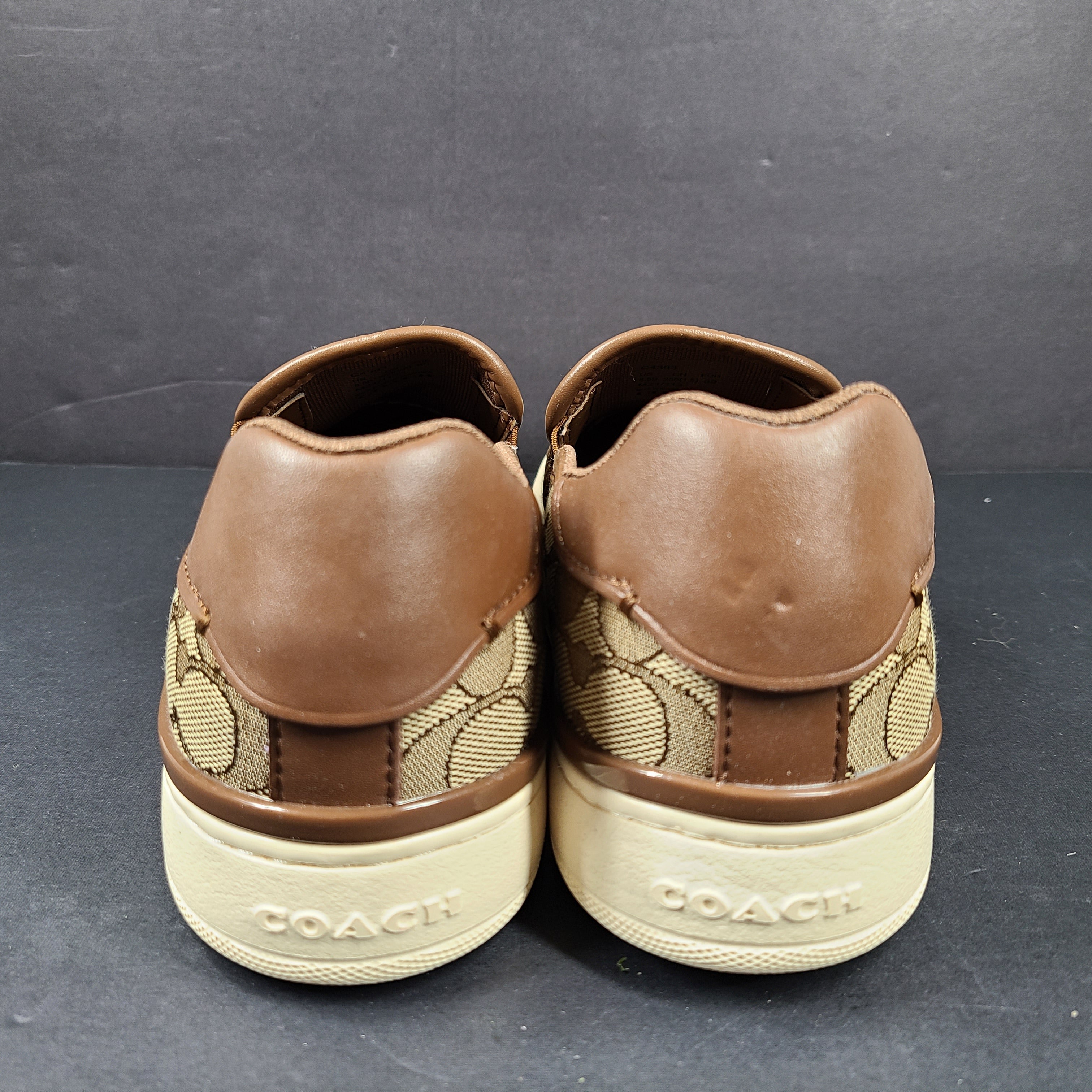 Coach slip-on sneakers model C4393 in brown, size 6.5B, designed for everyday wear.