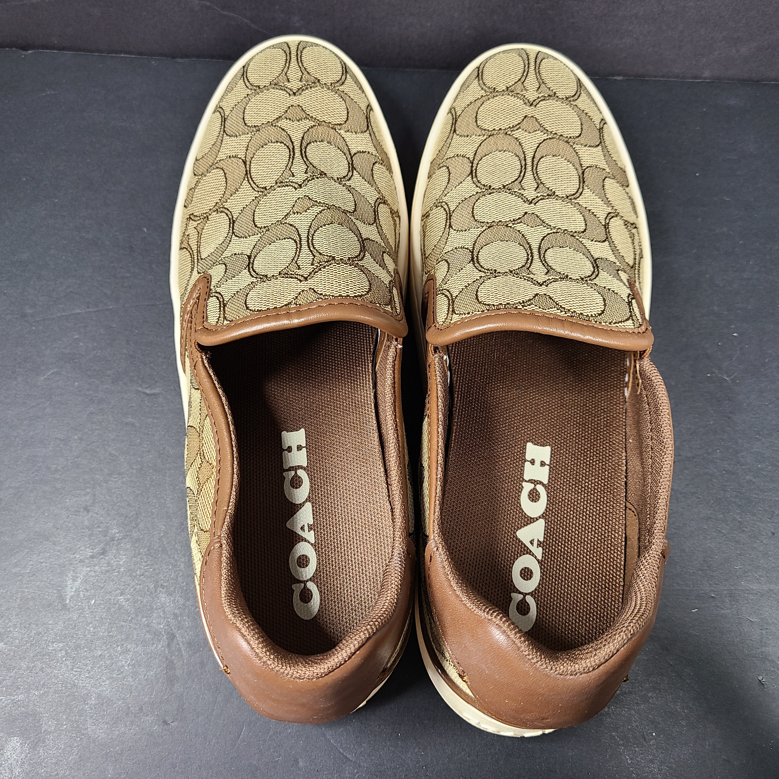 Coach slip-on sneakers model C4393 in brown, size 6.5B, designed for everyday wear.