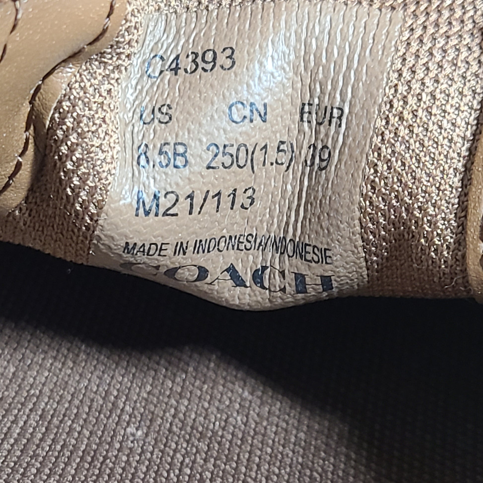 Coach slip-on sneakers model C4393 in brown, size 6.5B, designed for everyday wear.