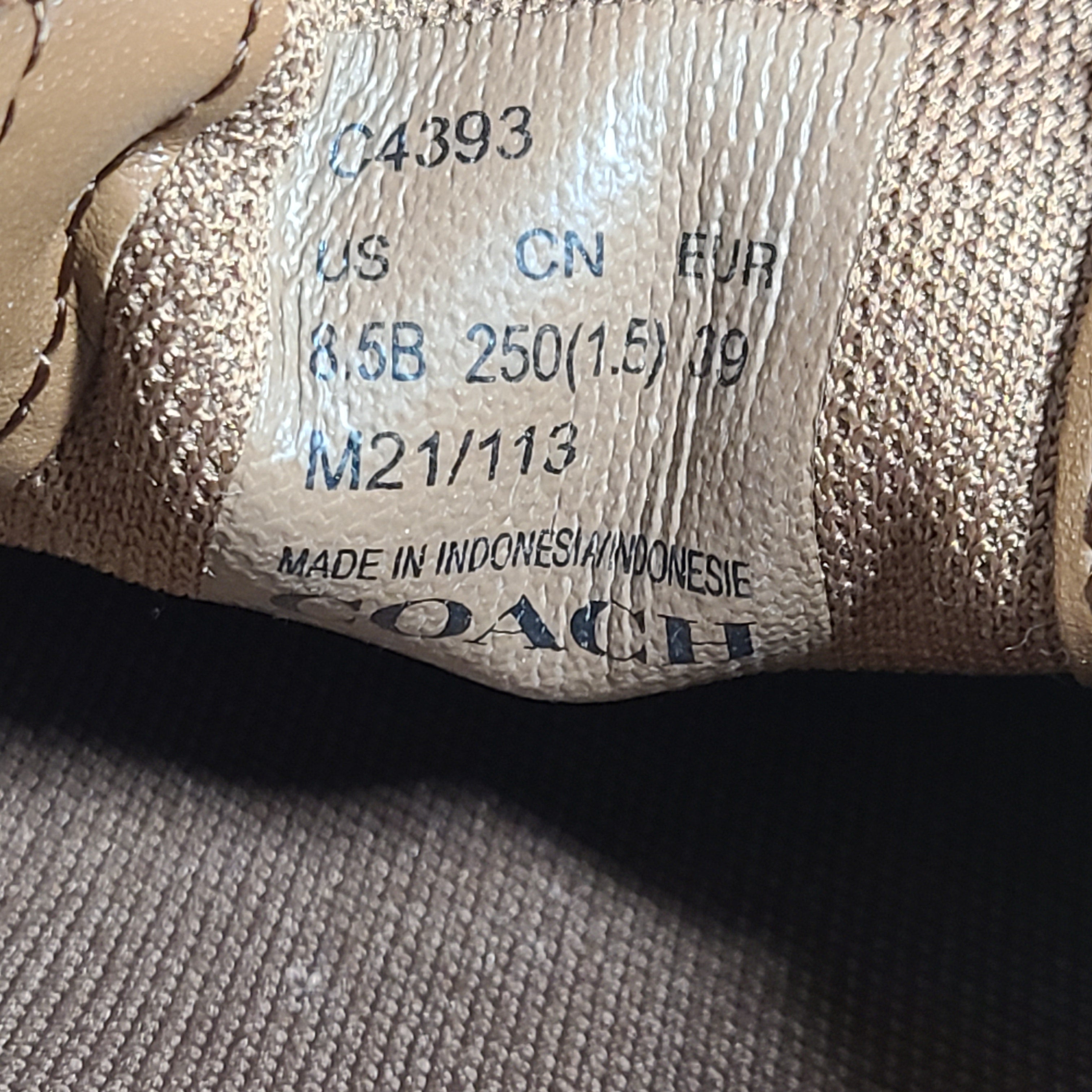 Coach slip-on sneakers model C4393 in brown, size 6.5B, designed for everyday wear.