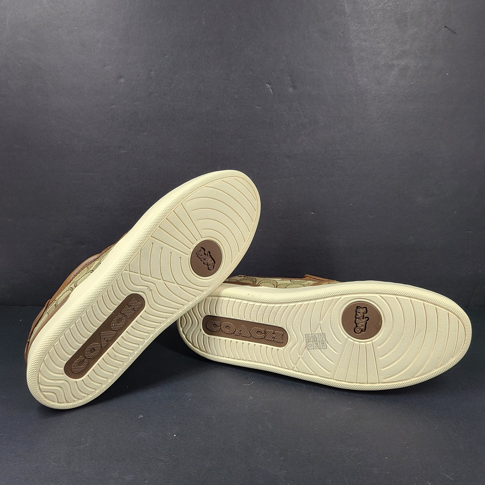 Coach slip-on sneakers model C4393 in brown, size 6.5B, designed for everyday wear.