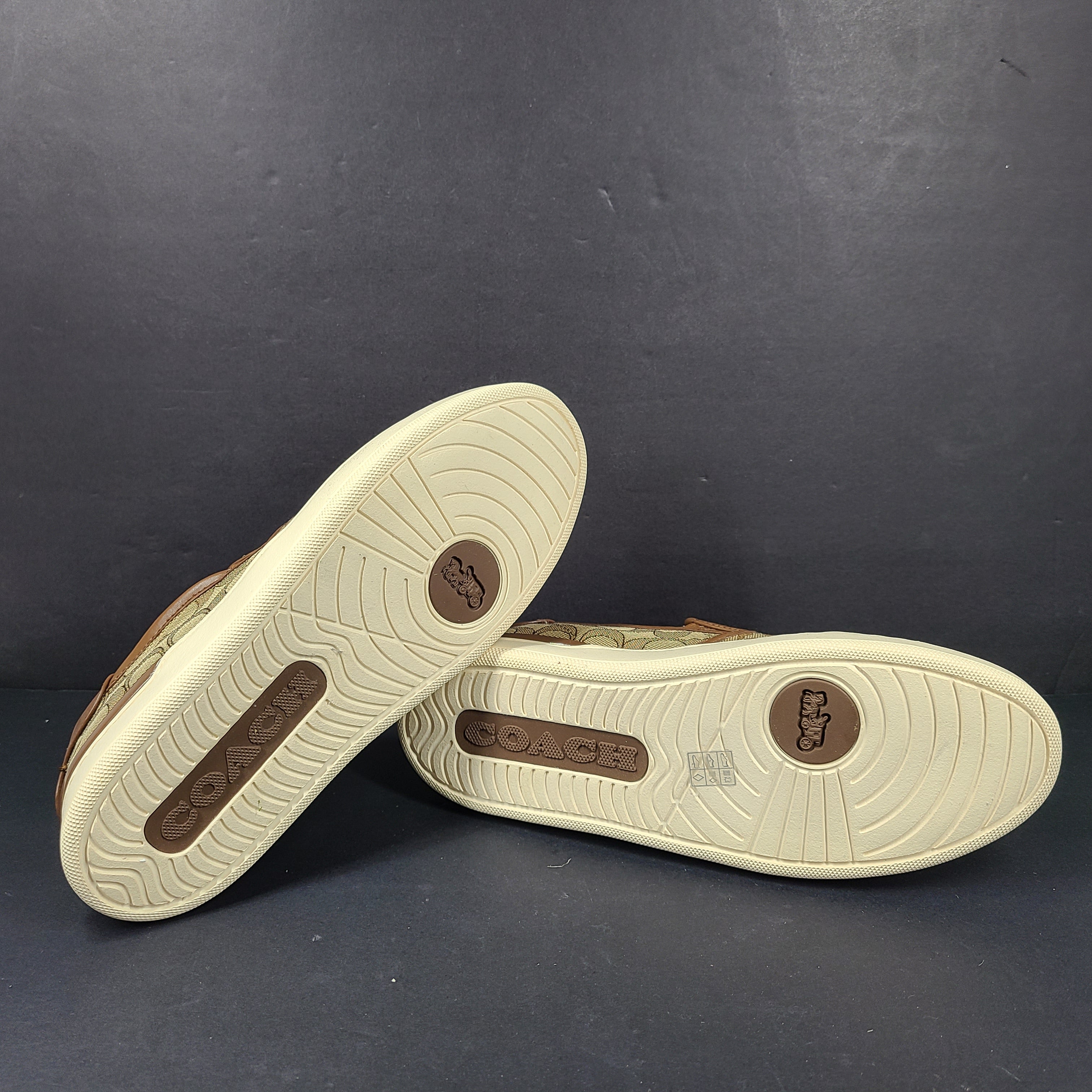 Coach slip-on sneakers model C4393 in brown, size 6.5B, designed for everyday wear.
