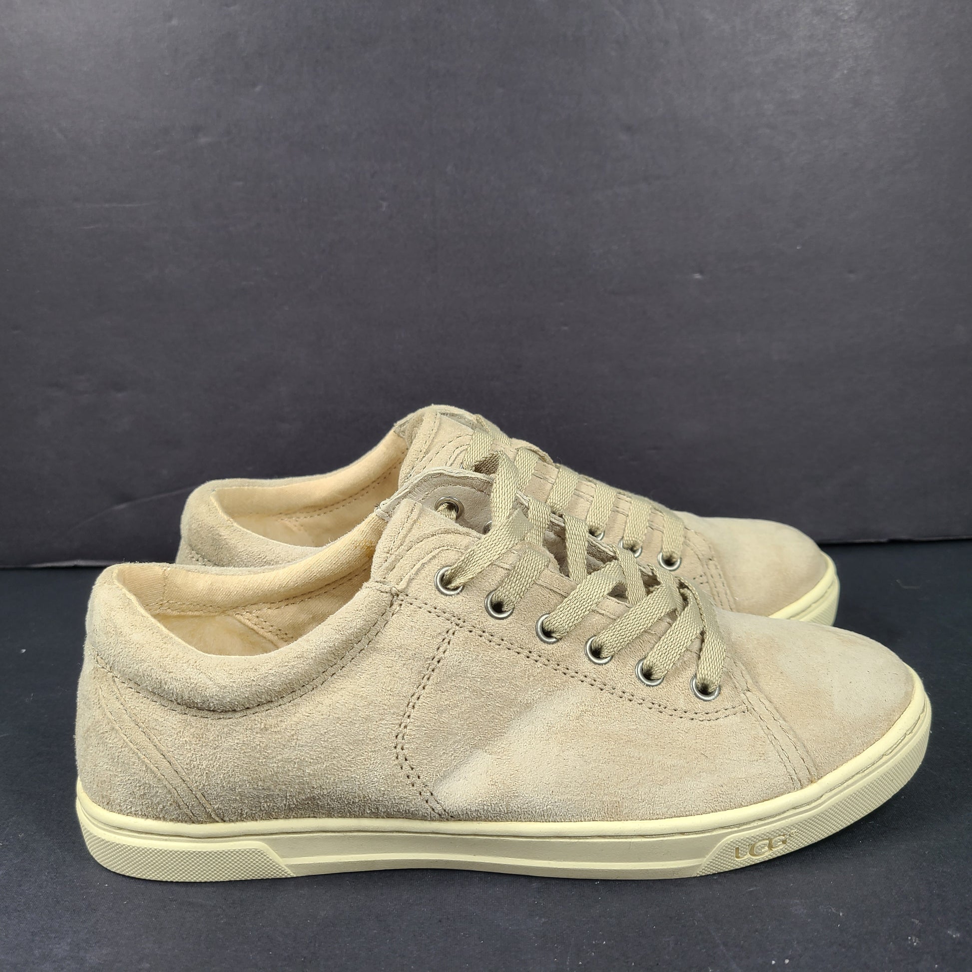 Beige UGG Tomi suede low-top sneakers in US size 7.5 designed for casual comfort.