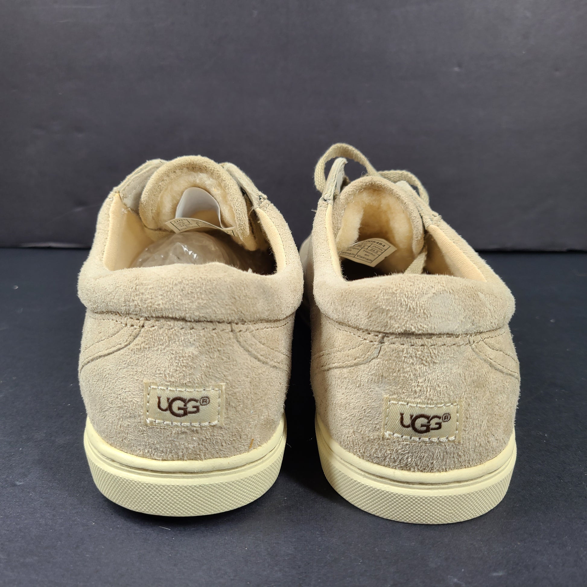 Beige UGG Tomi suede low-top sneakers in US size 7.5 designed for casual comfort.