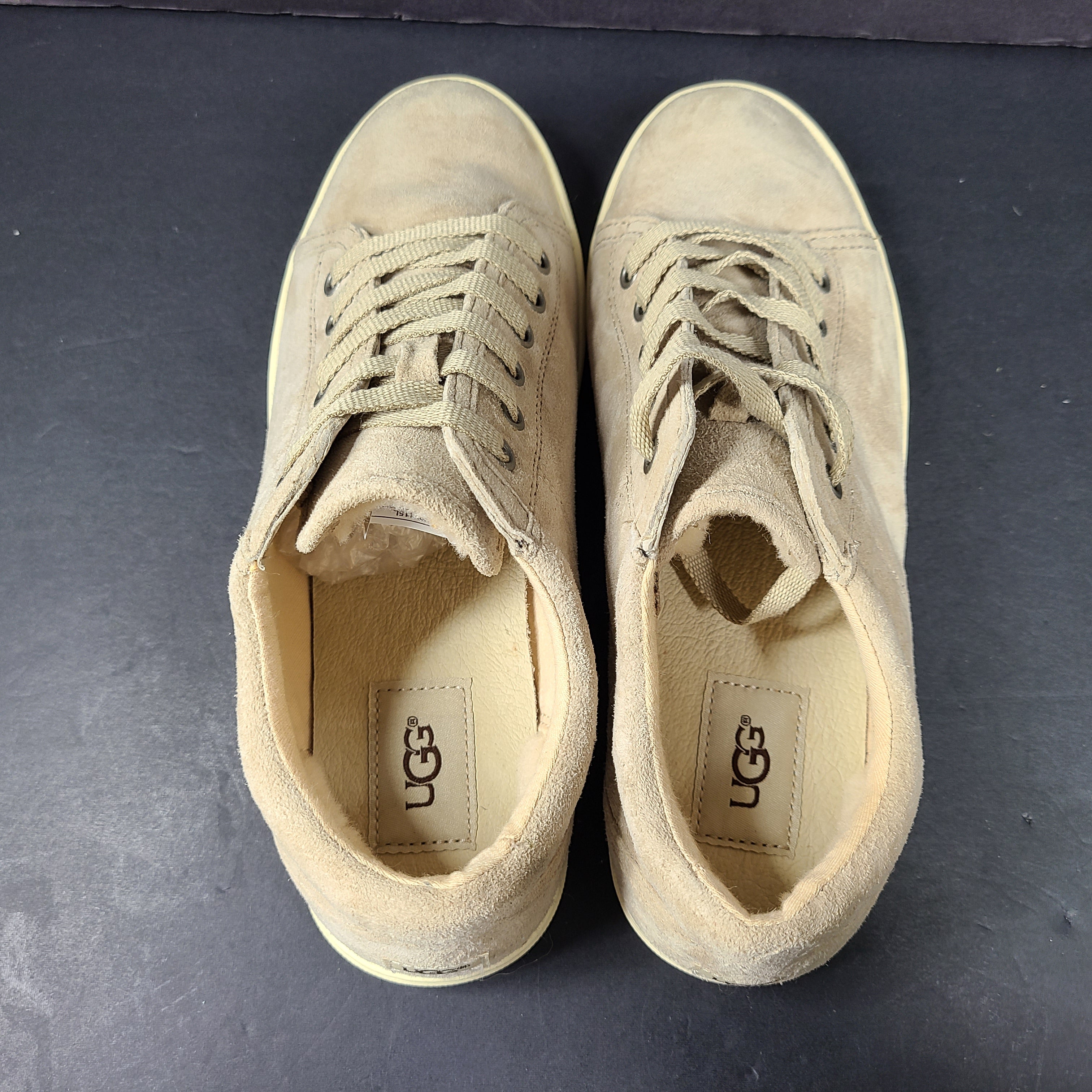 Beige UGG Tomi suede low-top sneakers in US size 7.5 designed for casual comfort.