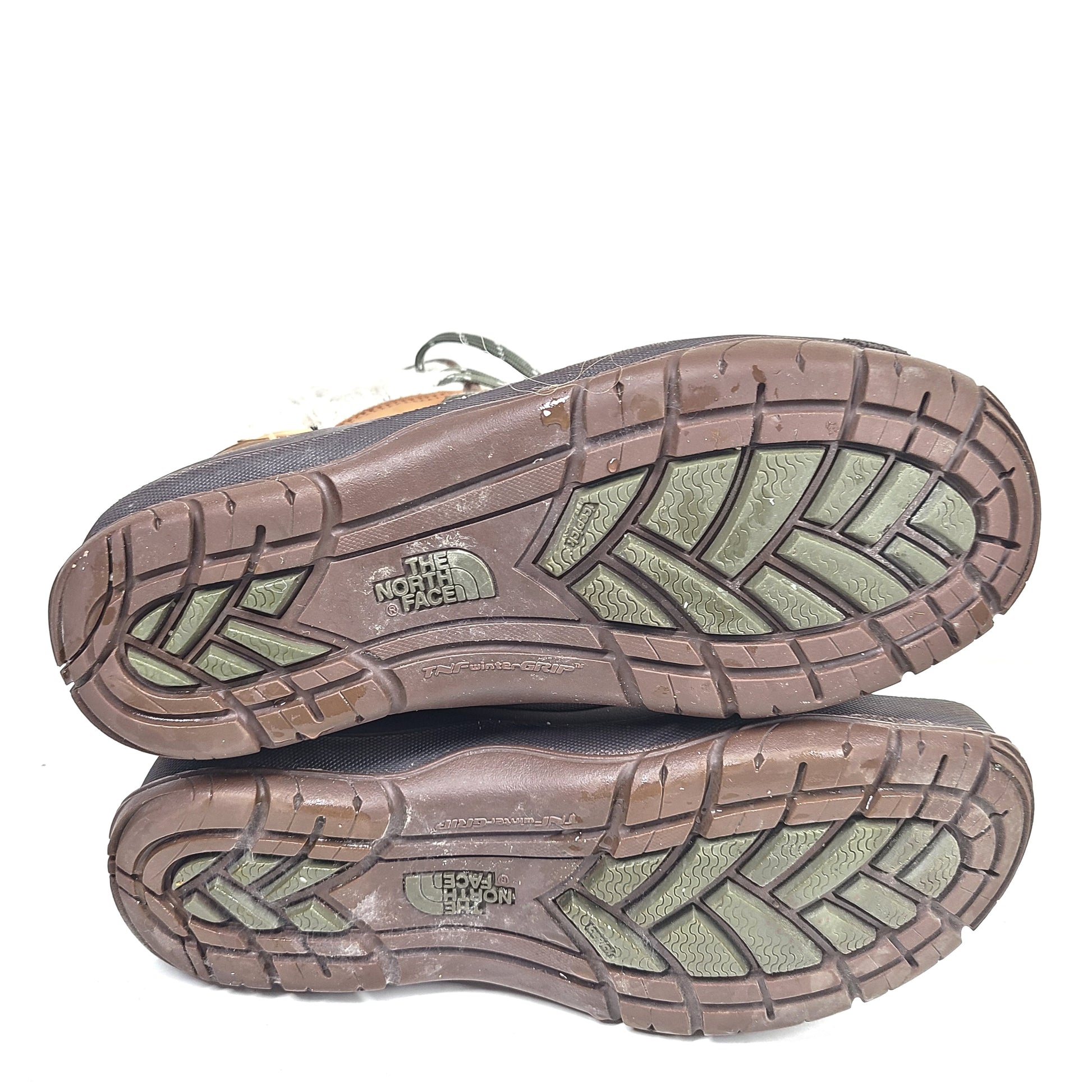 Sturdy brown and gray women's boots with faux fur lining and durable soles for outdoor use.