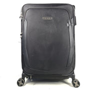 Black Samsonite Spinner 71/26 EXP suitcase with four spinner wheels and a telescoping handle.