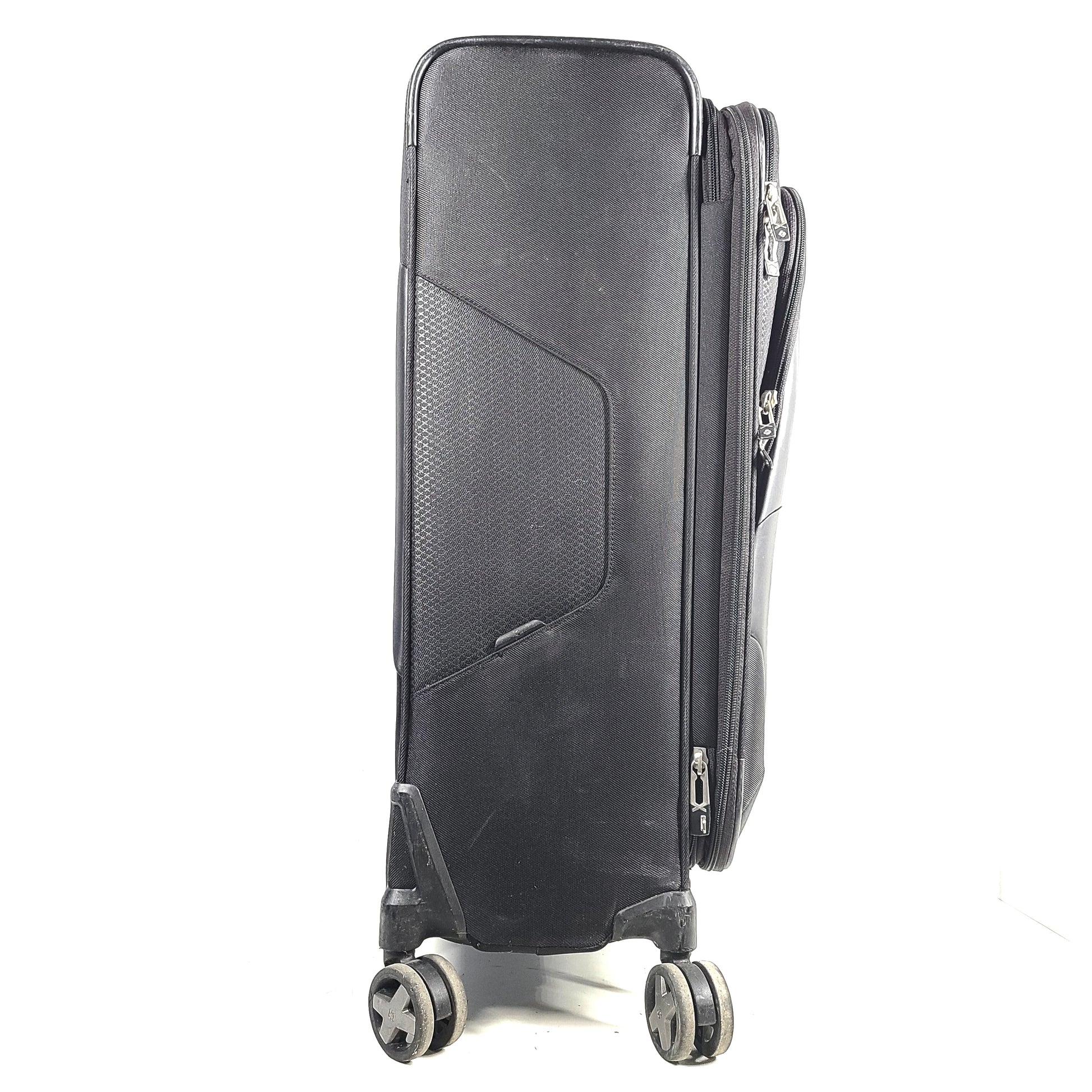 Black Samsonite Spinner 71/26 EXP suitcase with four spinner wheels and a telescoping handle.