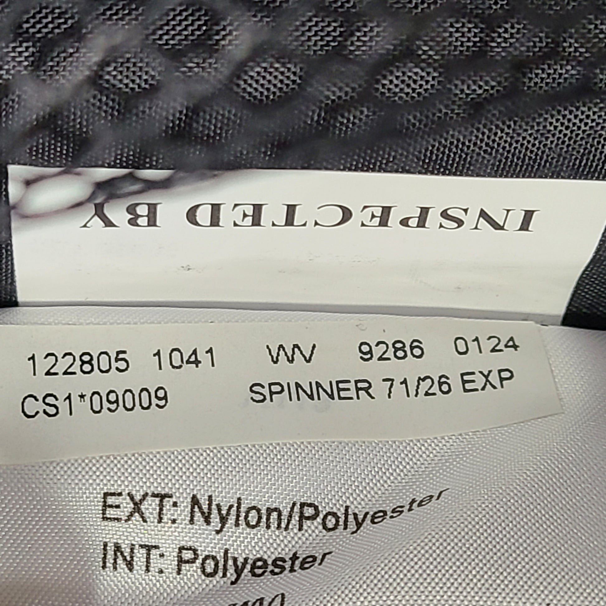 Black Samsonite Spinner 71/26 EXP suitcase with four spinner wheels and a telescoping handle.