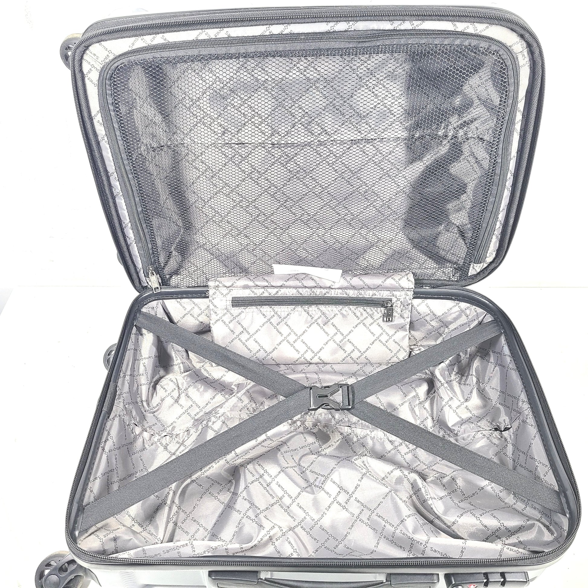 Blue Samsonite 8853 hard-shell spinner suitcase with exterior scuffs and a clean interior.