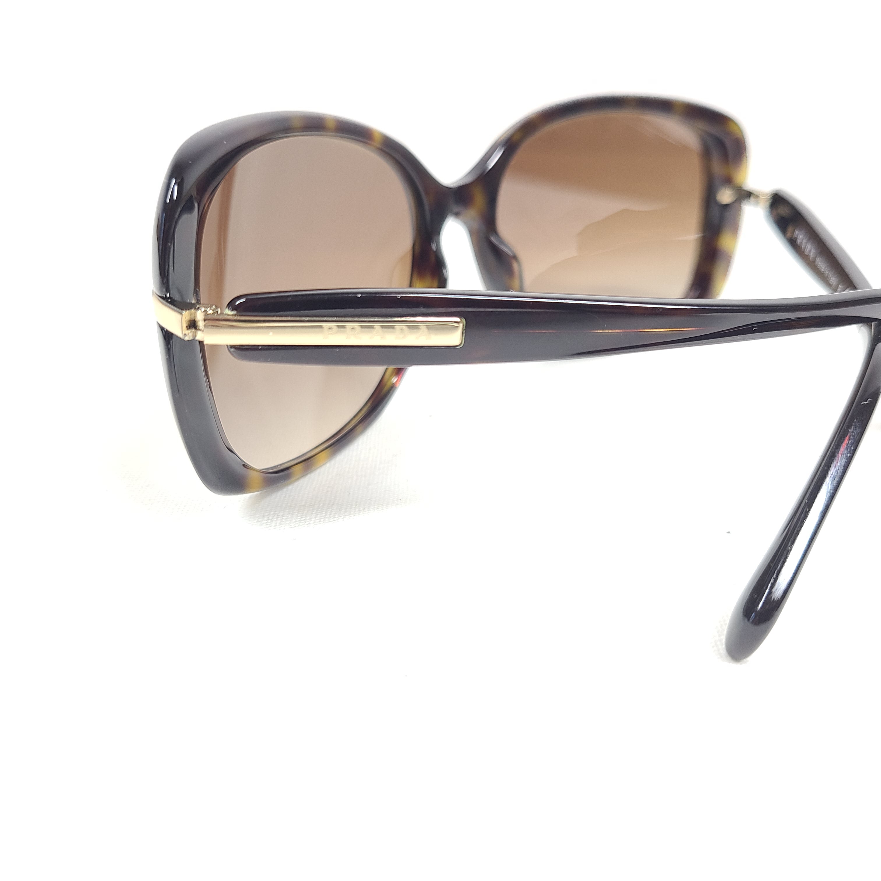 Prada SPR 080 tortoise brown butterfly-frame sunglasses with 57-17-130 sizing from Italy.