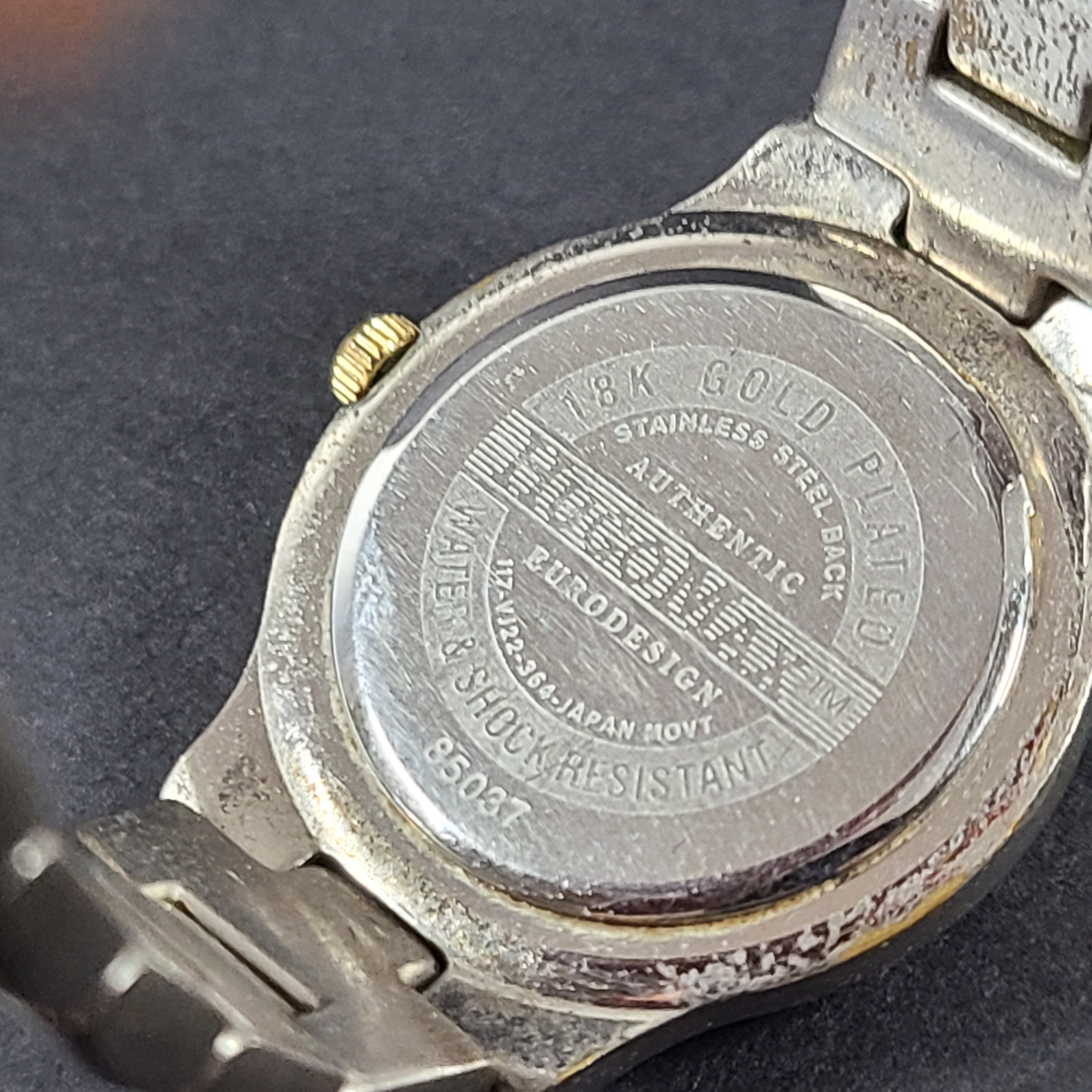 Two-tone Hugo Max wristwatch with 18K gold plating and stainless steel bracelet, model 85047.