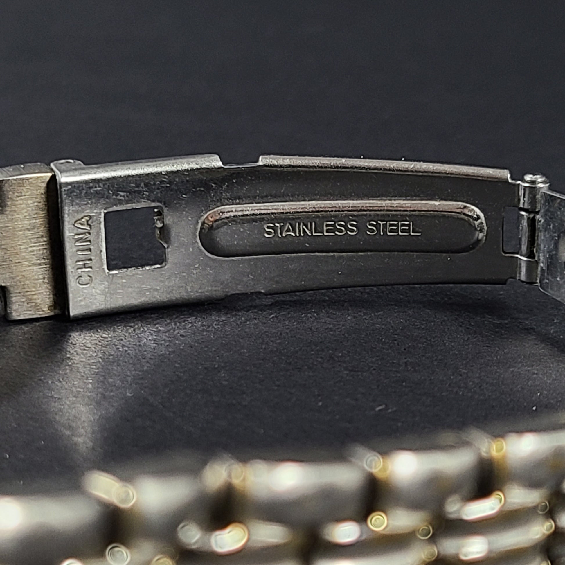 Two-tone Hugo Max wristwatch with 18K gold plating and stainless steel bracelet, model 85047.