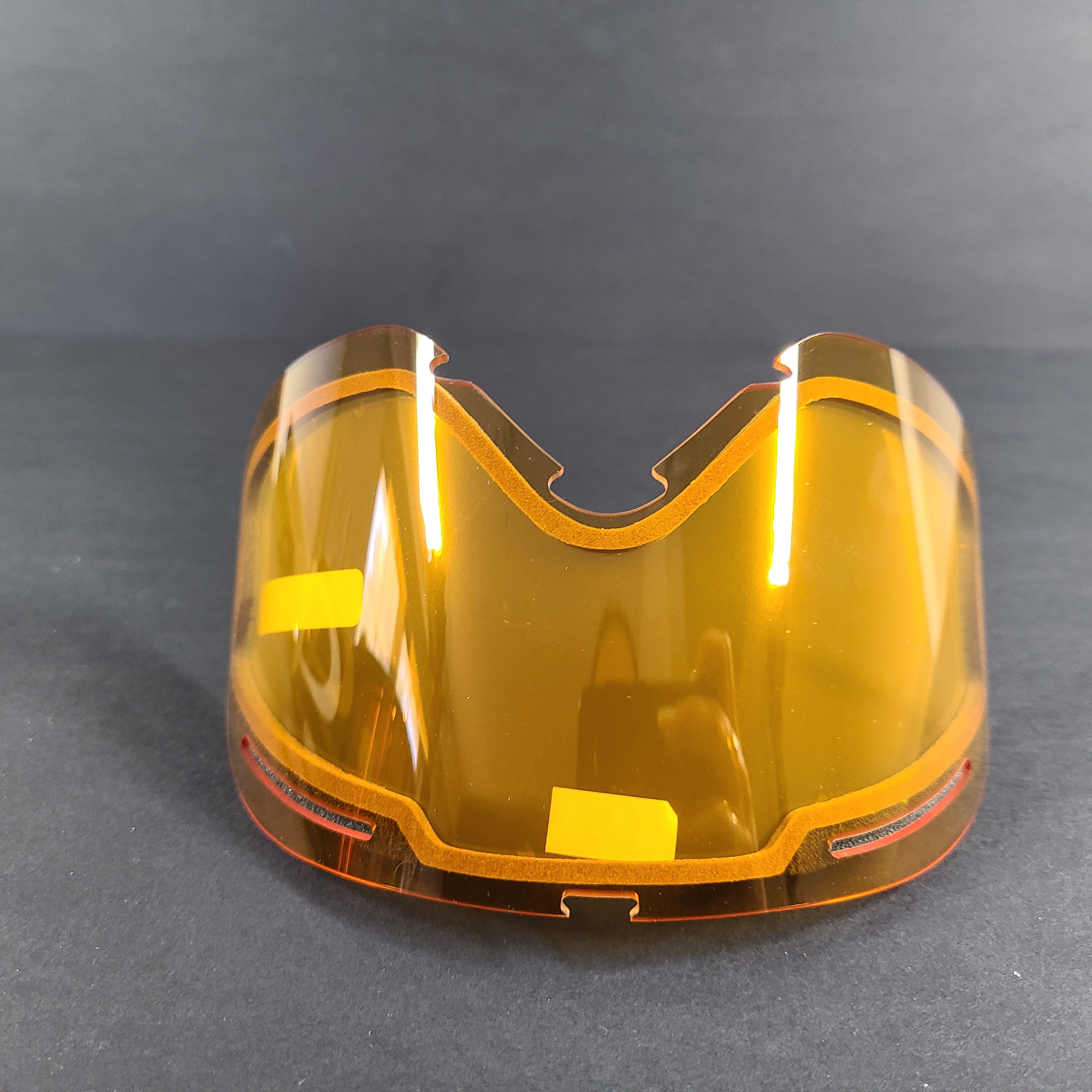 Oakley black snow goggles feature an orange lens and include an extra replacement lens and storage bag.