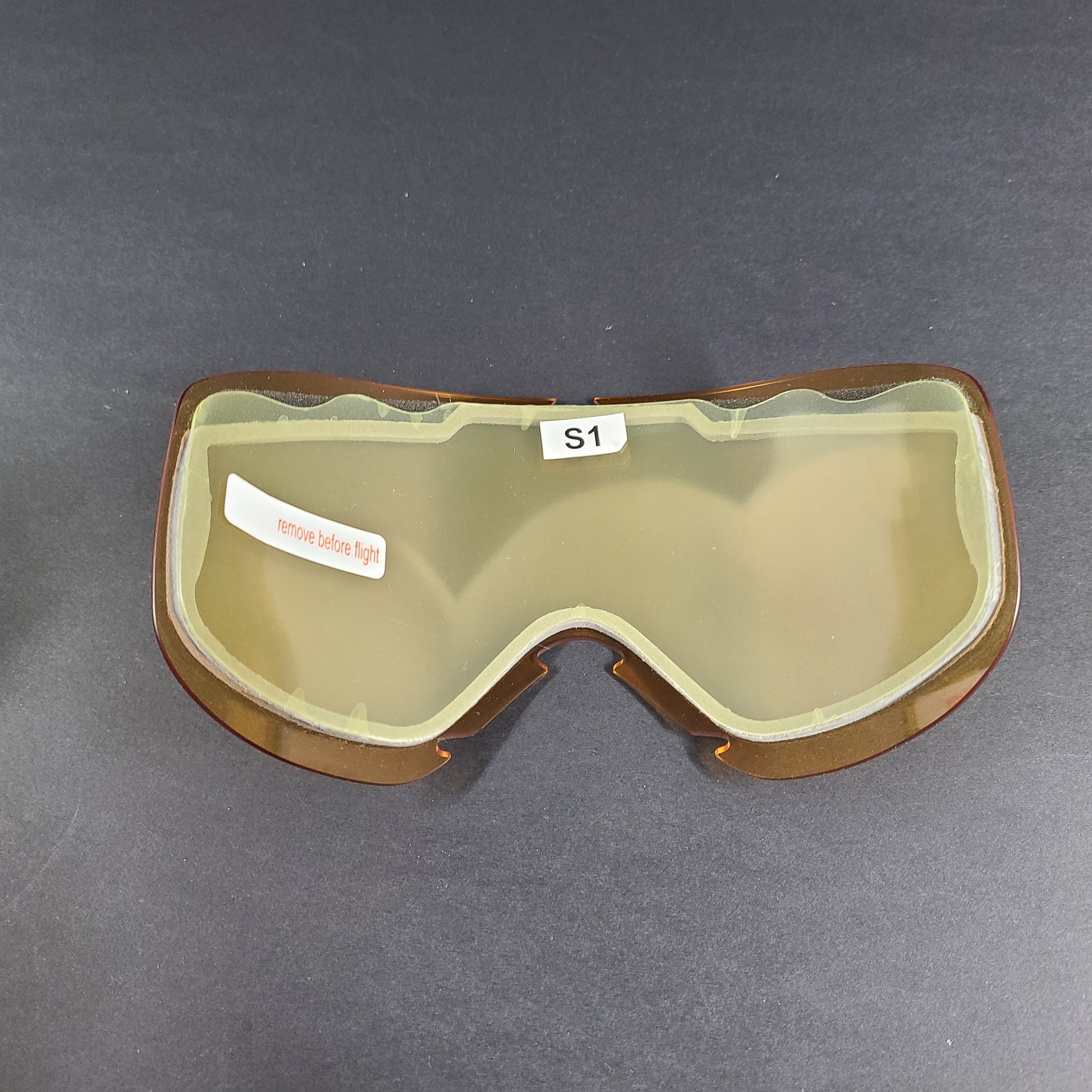 Oakley black snow goggles feature an orange lens and include an extra replacement lens and storage bag.