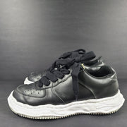 Black and white Maison Mihara Yasuhiro Wayne low-top leather sneakers with original sculpted OG sole and MMY branding.