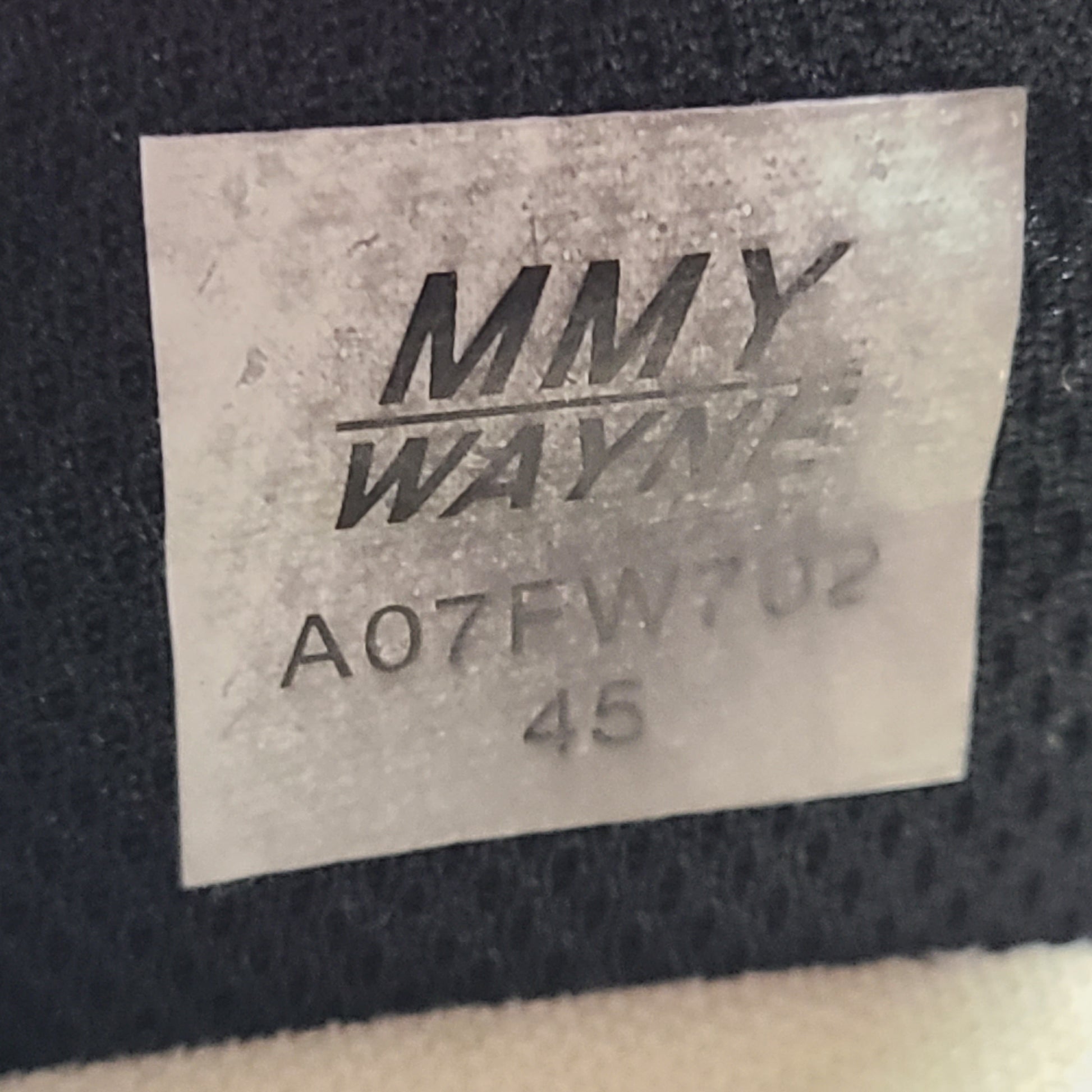 Black and white Maison Mihara Yasuhiro Wayne low-top leather sneakers with original sculpted OG sole and MMY branding.