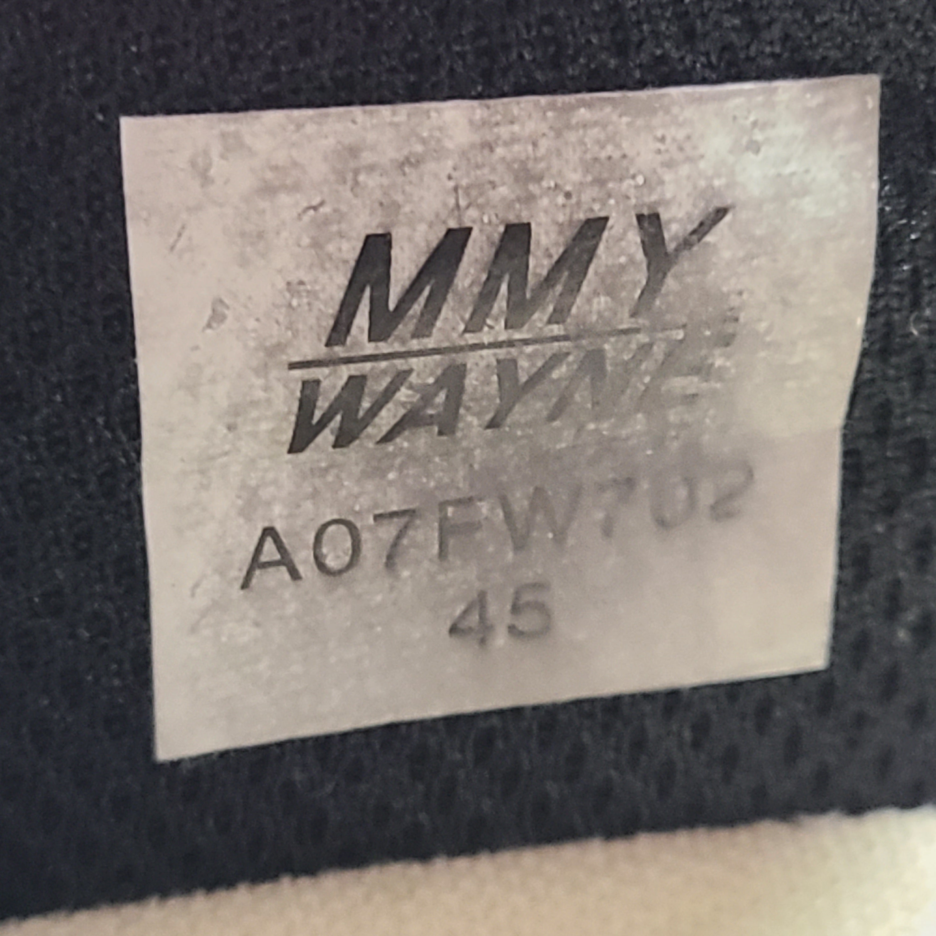 Black and white Maison Mihara Yasuhiro Wayne low-top leather sneakers with original sculpted OG sole and MMY branding.