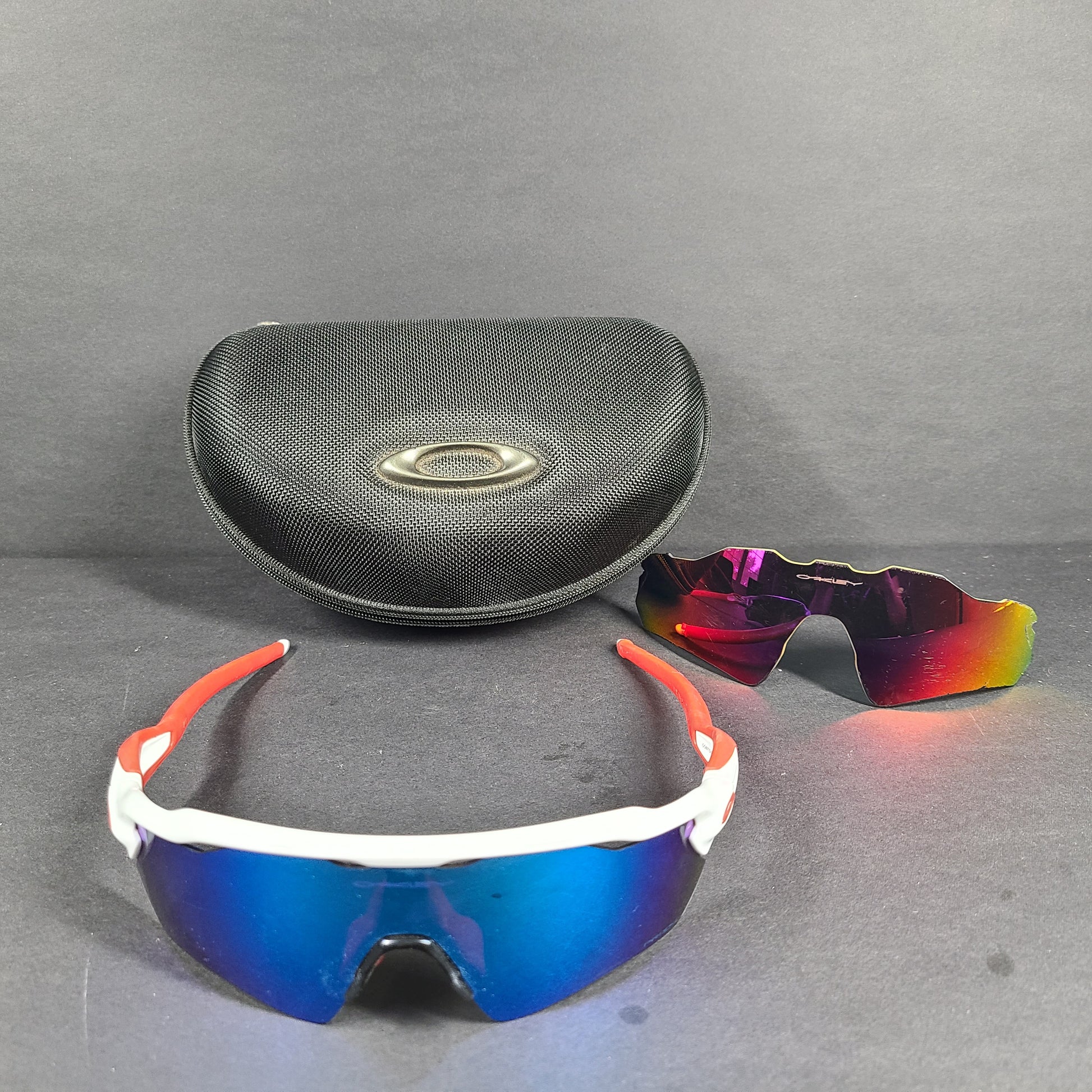Oakley Radar EV Path lens kit with red, white and blue accents and an extra replacement lens, packaged with an original case.