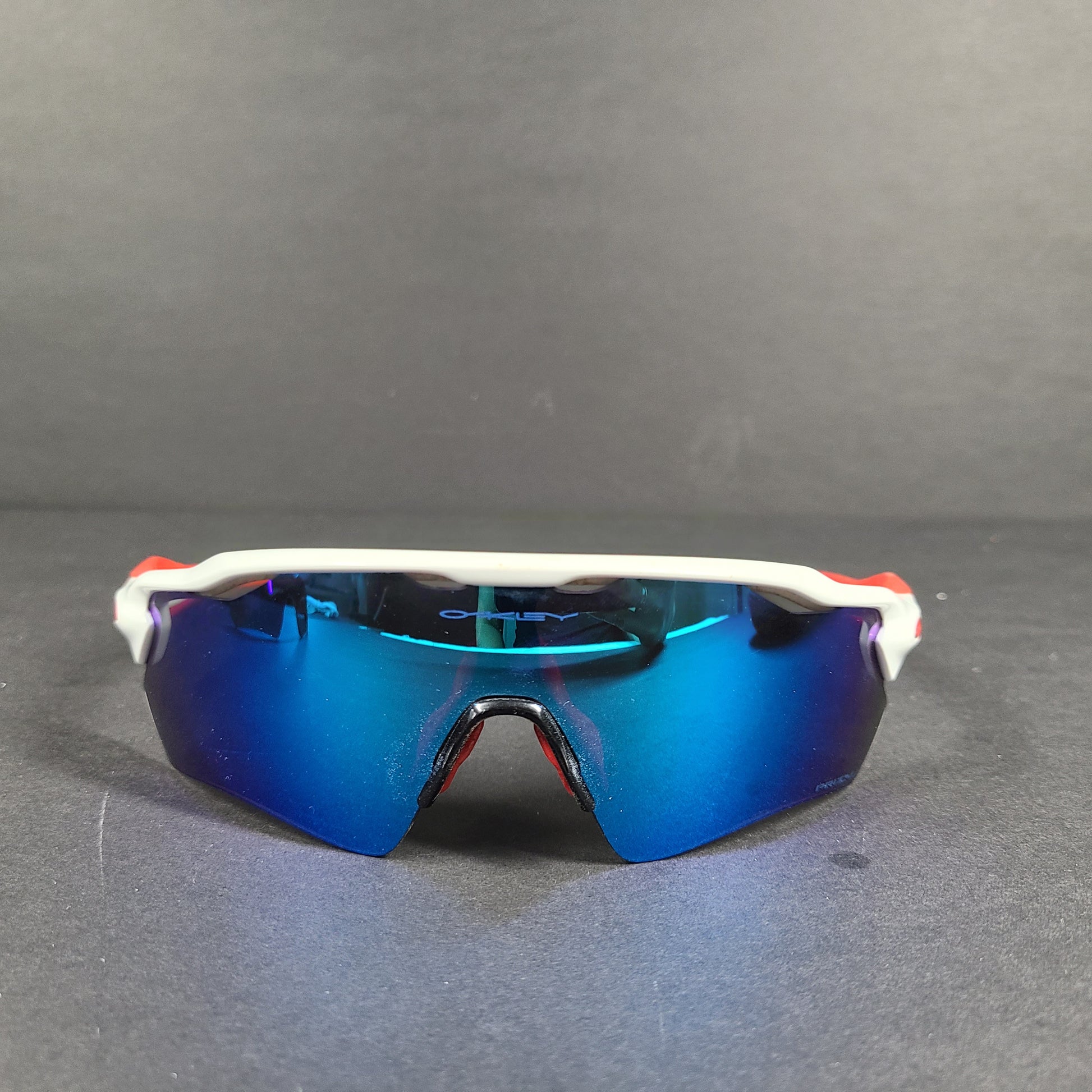 Oakley Radar EV Path lens kit with red, white and blue accents and an extra replacement lens, packaged with an original case.