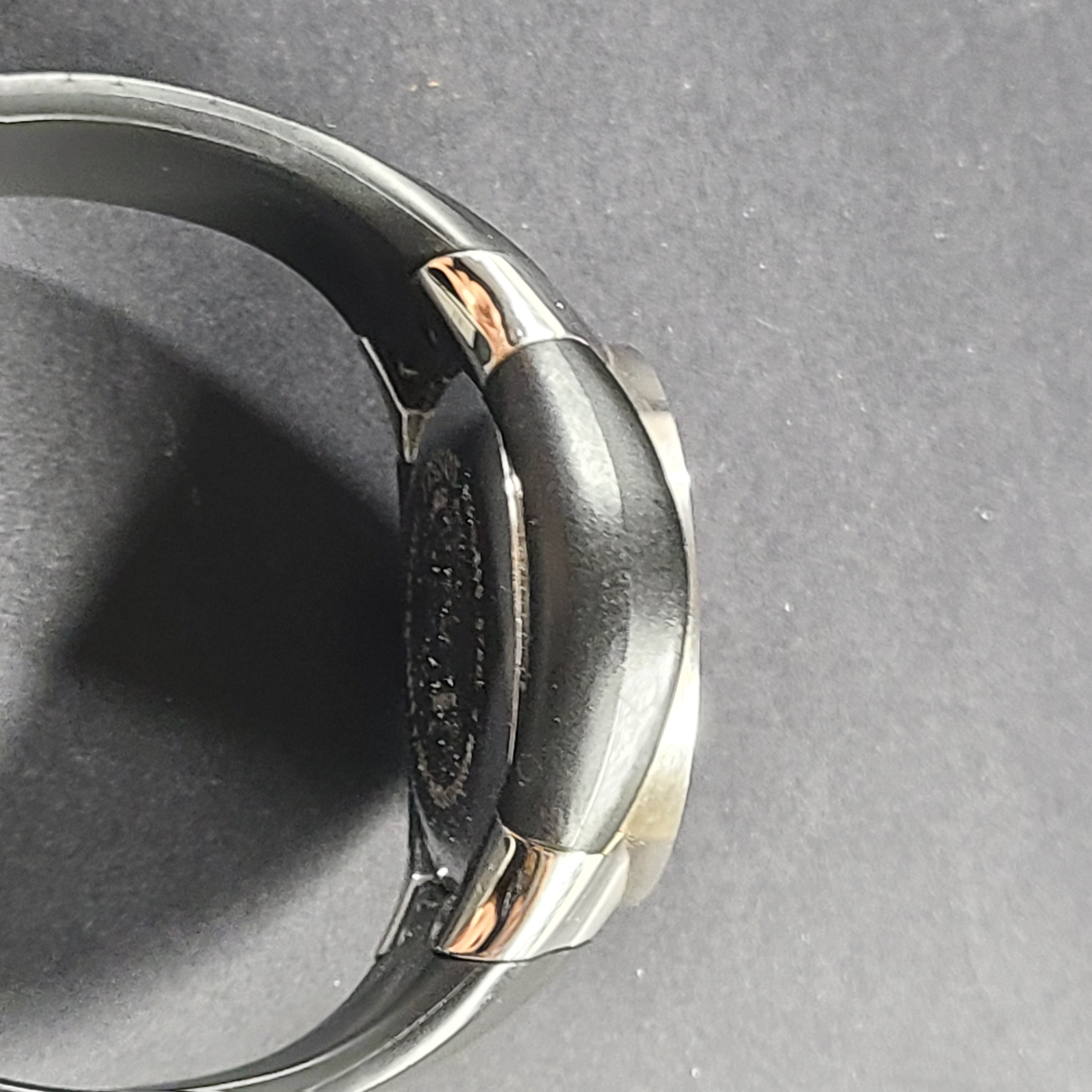 Tissot T Navigator 3000 stainless steel wristwatch with black dial and metal bracelet.