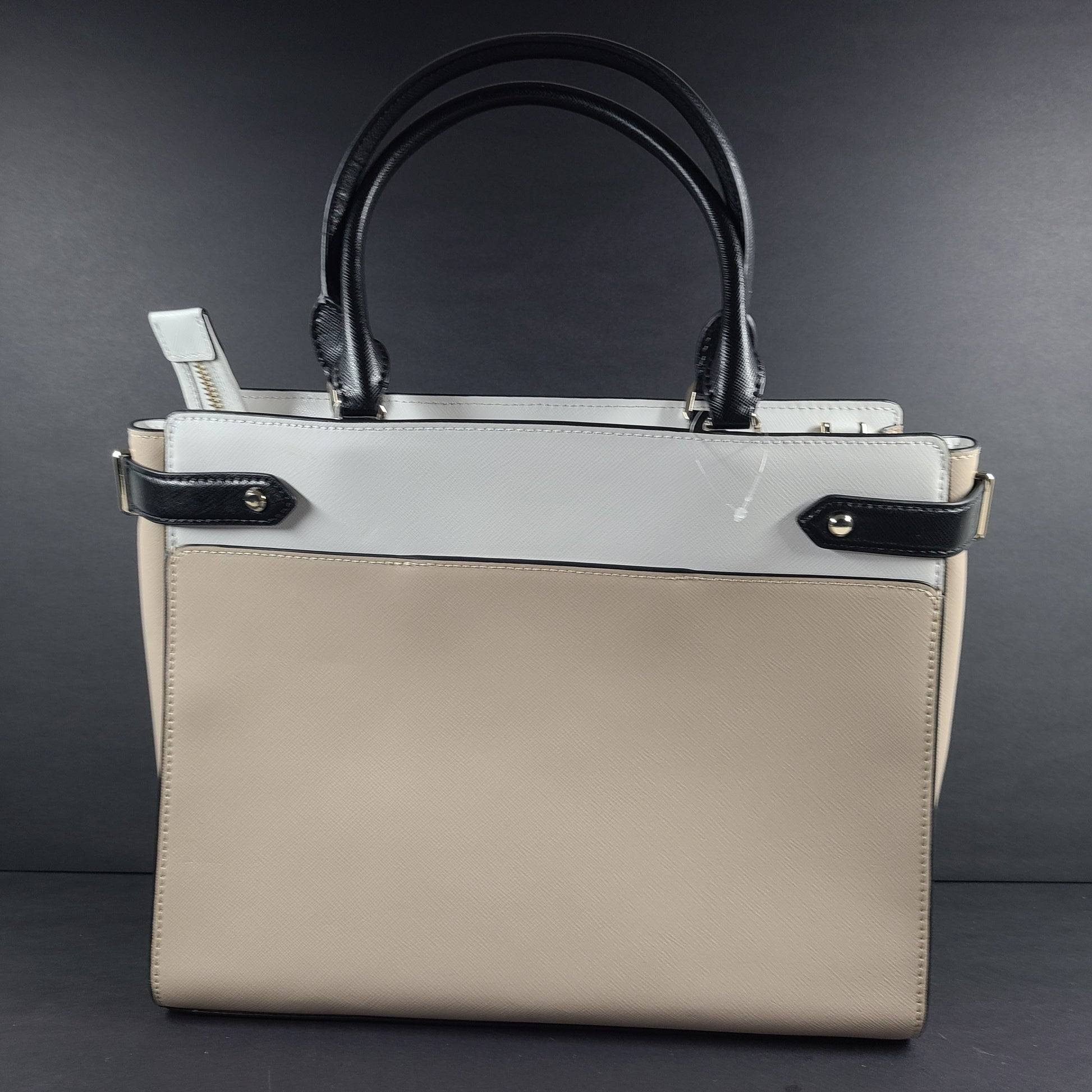Kate Spade New York beige and black tote with shoulder strap and interior logo label.