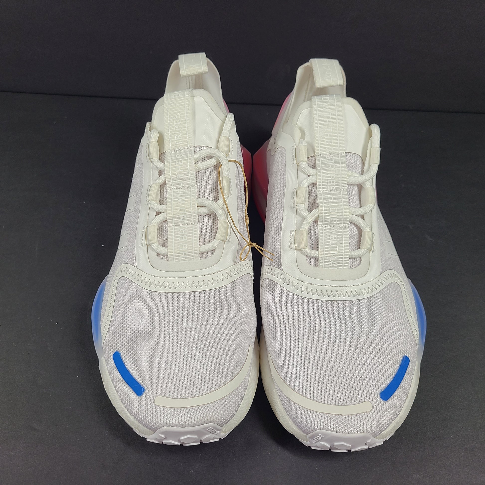 Adidas Parley multicolor low-top sneakers in US size 5.5 with white, red, and blue accents.