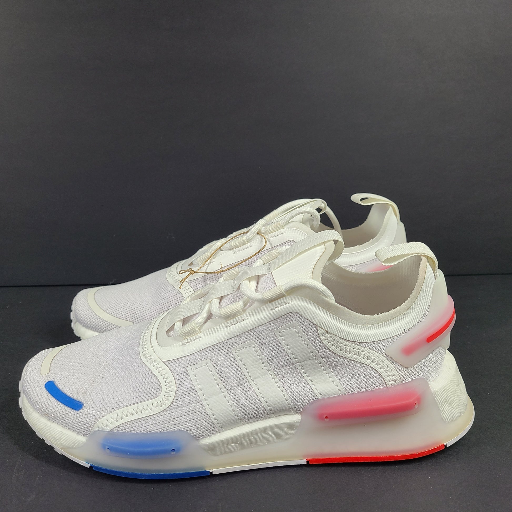 Adidas Parley multicolor low-top sneakers in US size 5.5 with white, red, and blue accents.