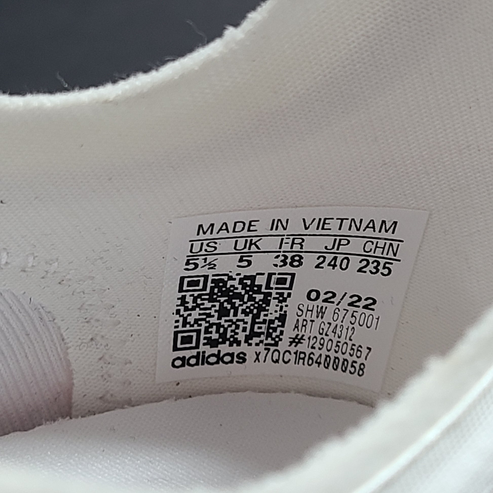 Adidas Parley multicolor low-top sneakers in US size 5.5 with white, red, and blue accents.