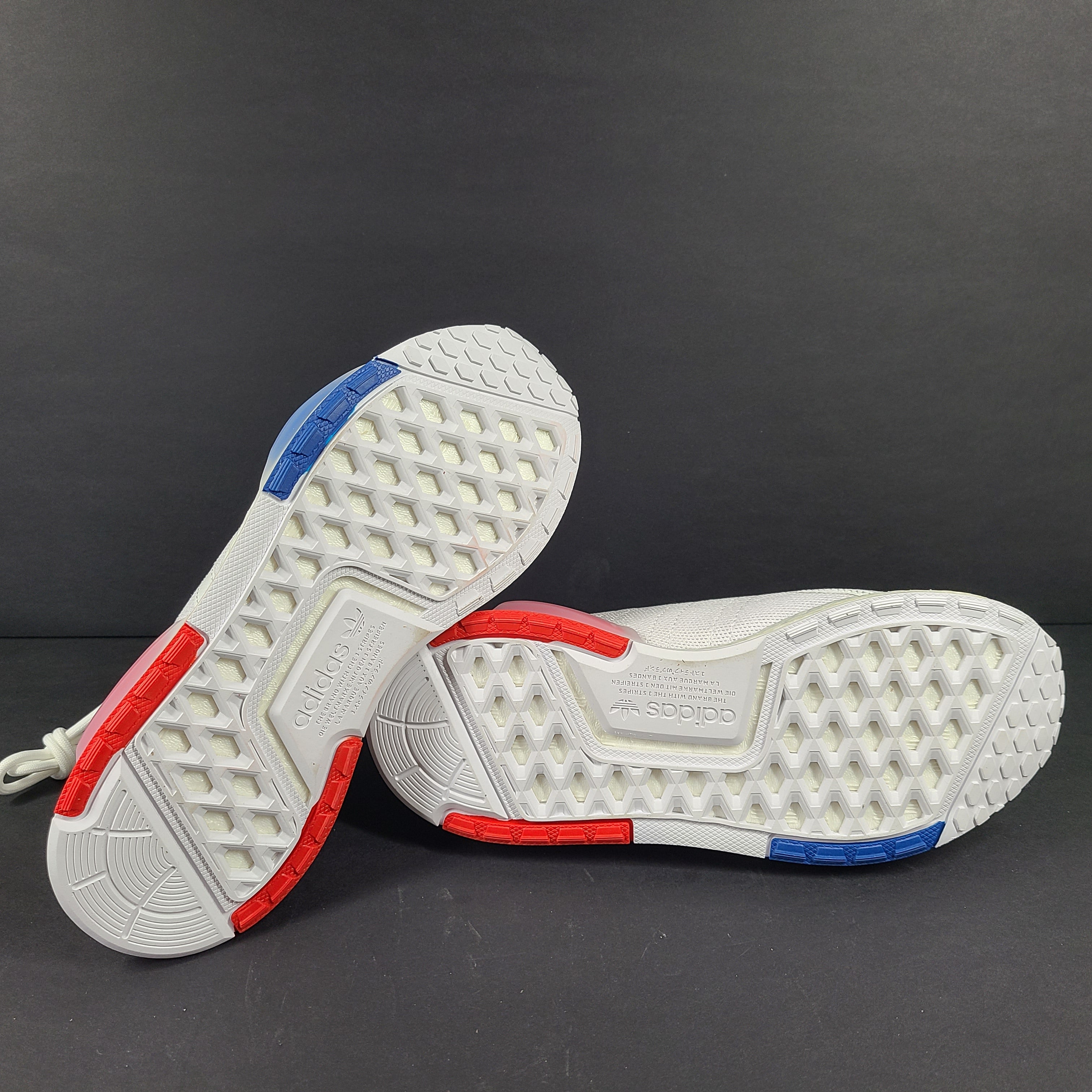 Adidas Parley multicolor low-top sneakers in US size 5.5 with white, red, and blue accents.