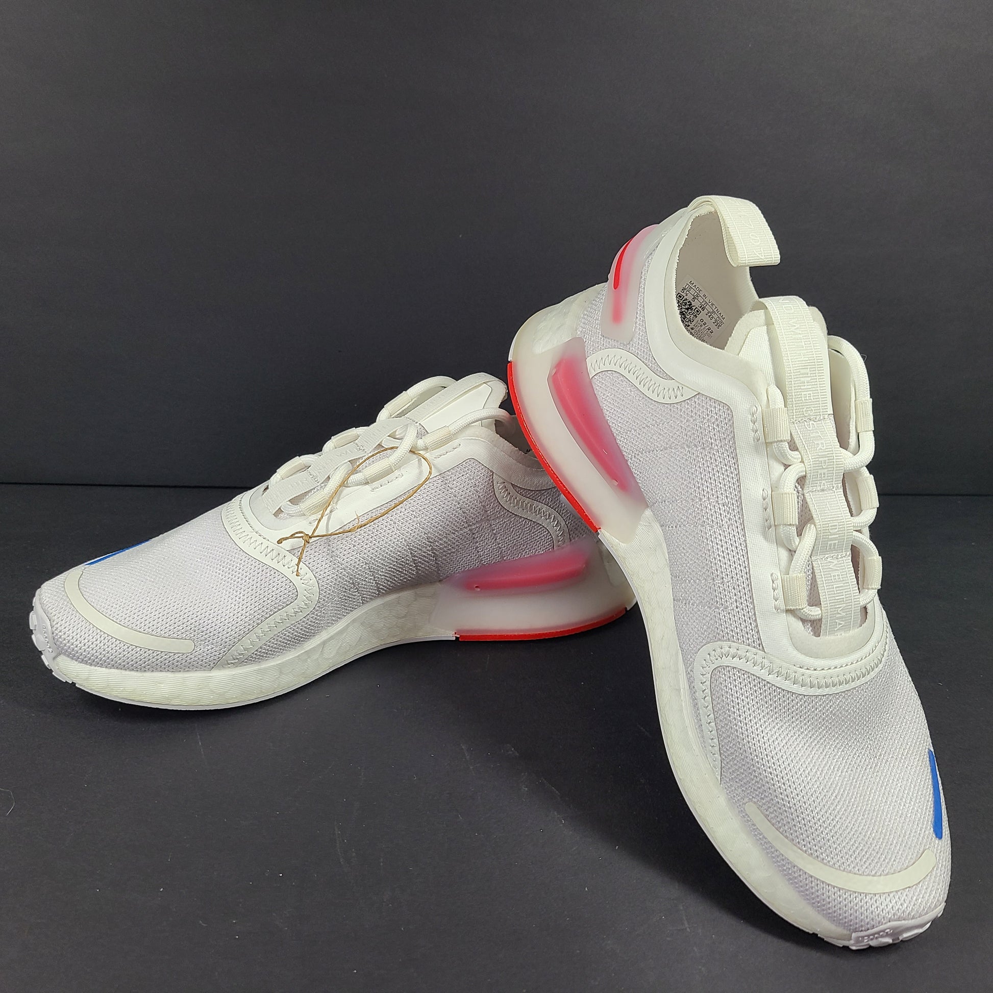 Adidas Parley multicolor low-top sneakers in US size 5.5 with white, red, and blue accents.