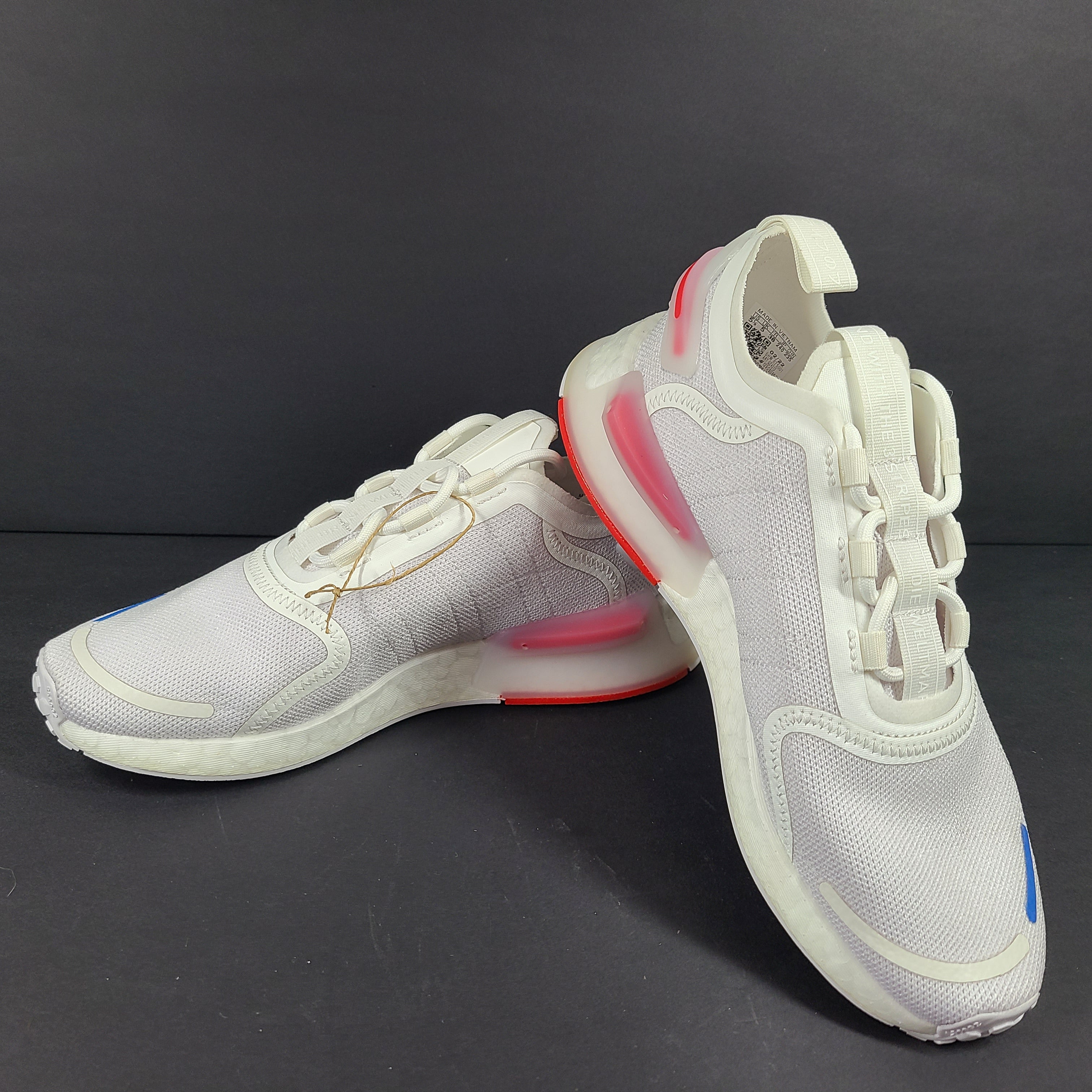 Adidas Parley multicolor low-top sneakers in US size 5.5 with white, red, and blue accents.