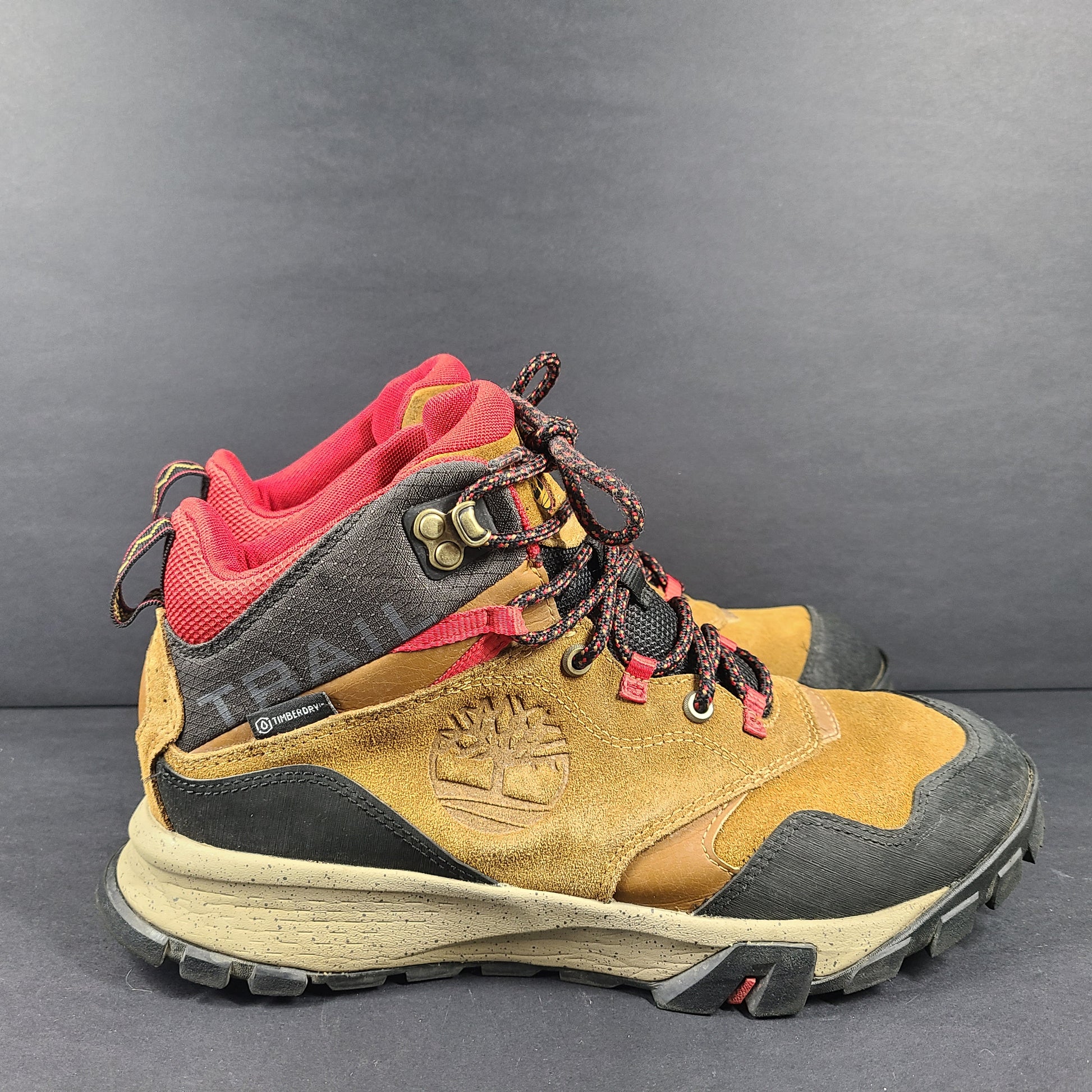 Timberland A23DV men's trail boots in brown and red with Timbergrip soles and US 9 sizing.