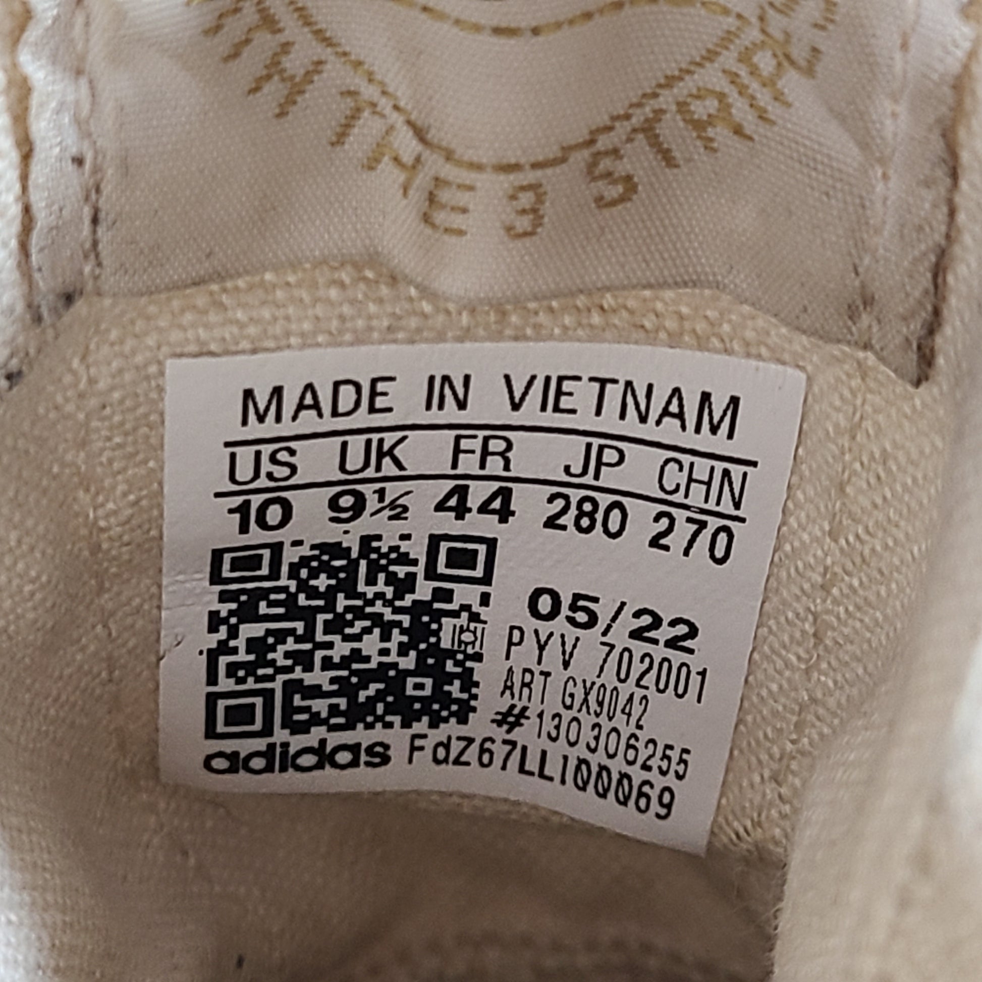 Adidas Nizza Hi XY22 beige high-top sneakers with a platform profile and gum outsole.