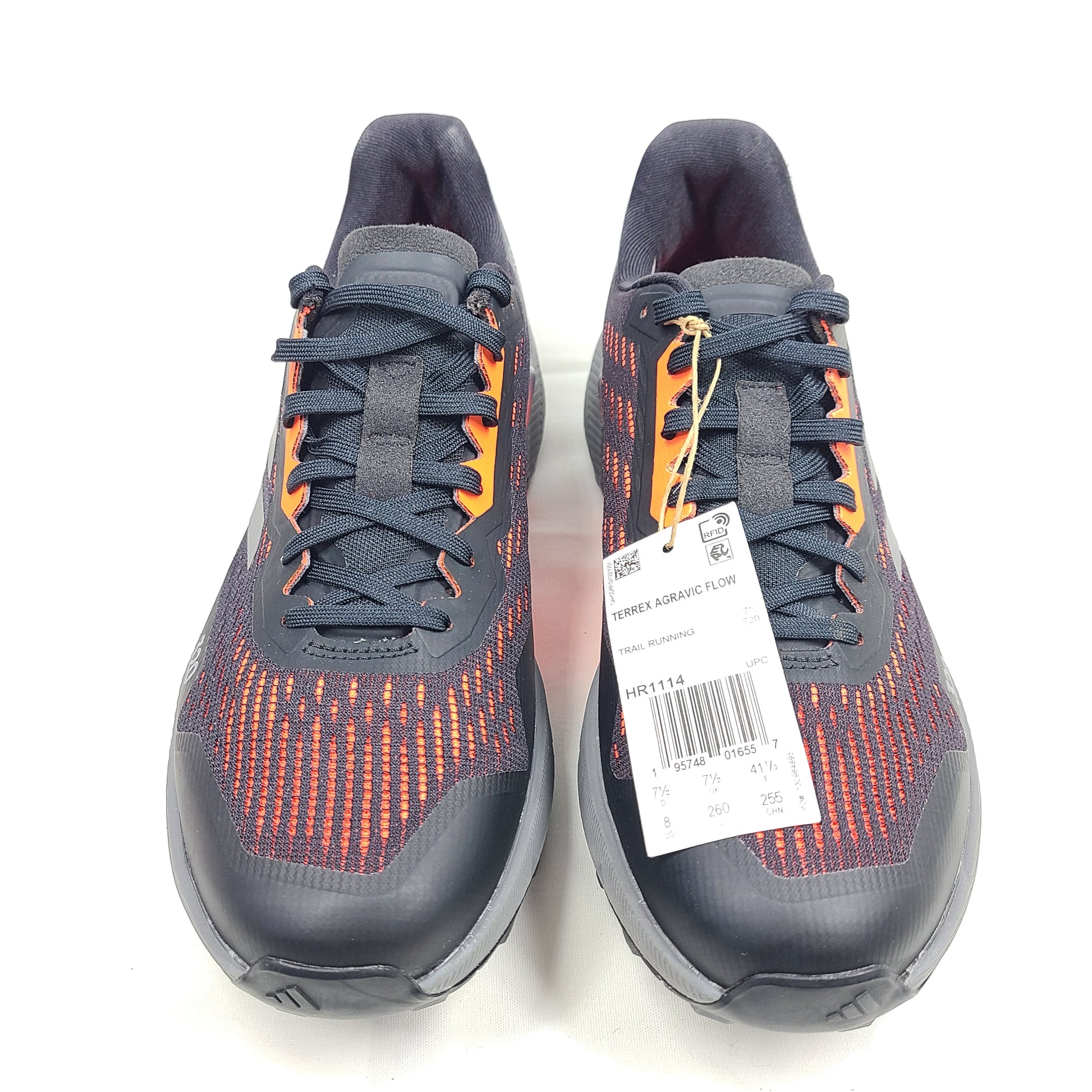 Black, orange, and gray Adidas Terrex Agravic Flow trail running shoe in US size 8 with responsive cushioning and a grippy outsole.