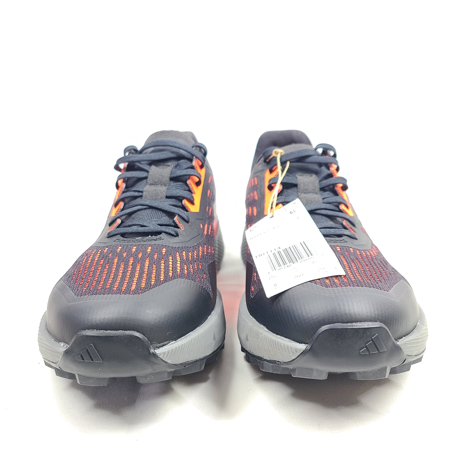 Black, orange, and gray Adidas Terrex Agravic Flow trail running shoe in US size 8 with responsive cushioning and a grippy outsole.