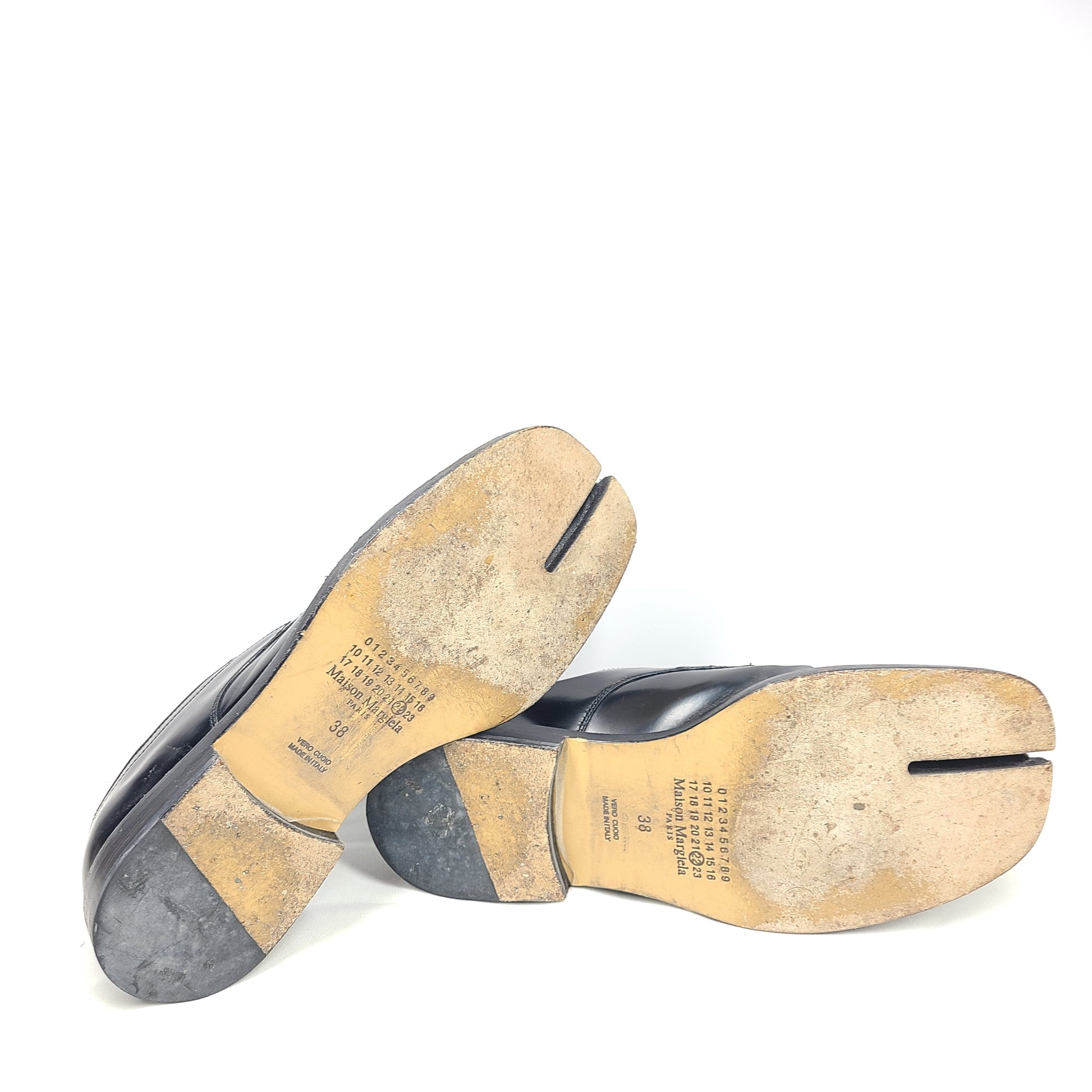 Maison Margiela black Tabi split-toe leather shoes in European size 38, made in Italy, with moderate wear on soles and uppers.