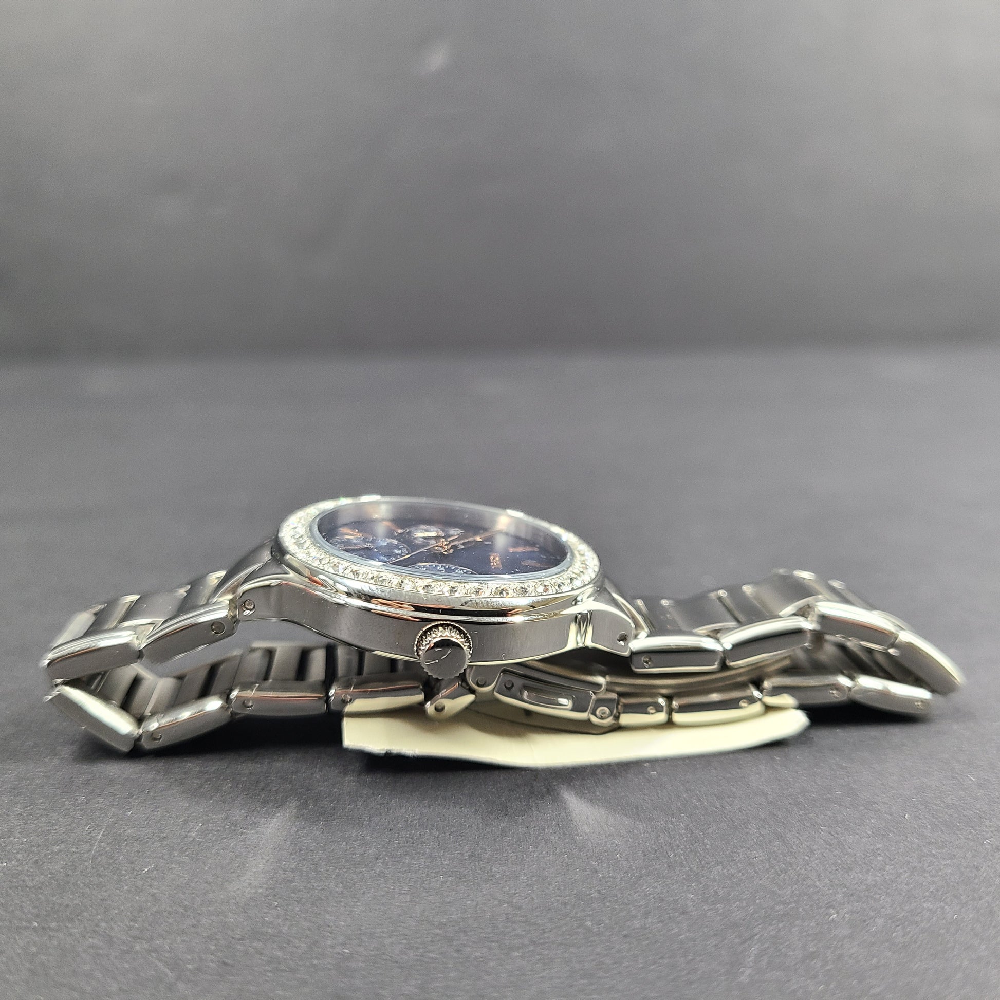 Sleek stainless-steel Fossil wristwatch with a blue dial and a slim 9mm case.