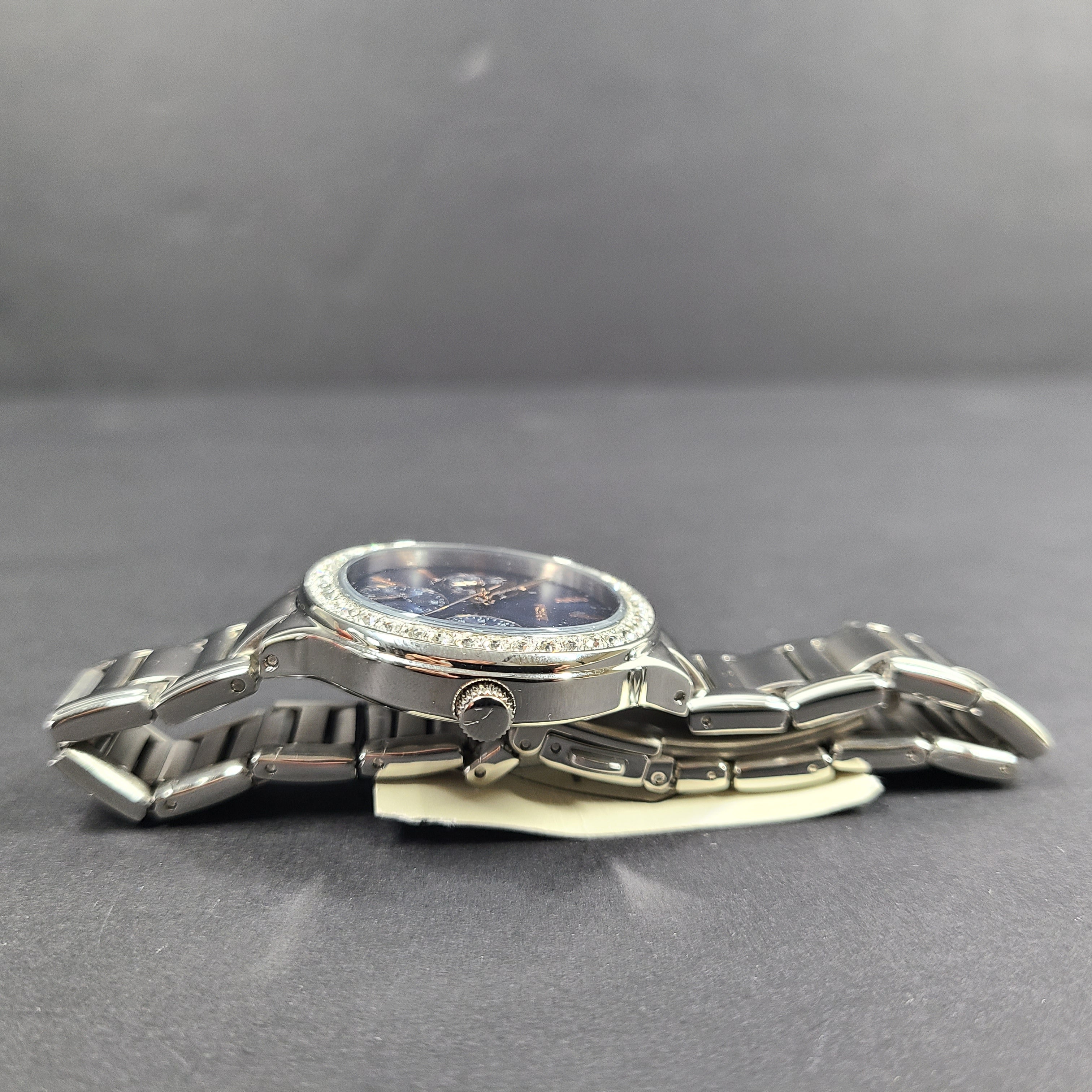 Sleek stainless-steel Fossil wristwatch with a blue dial and a slim 9mm case.